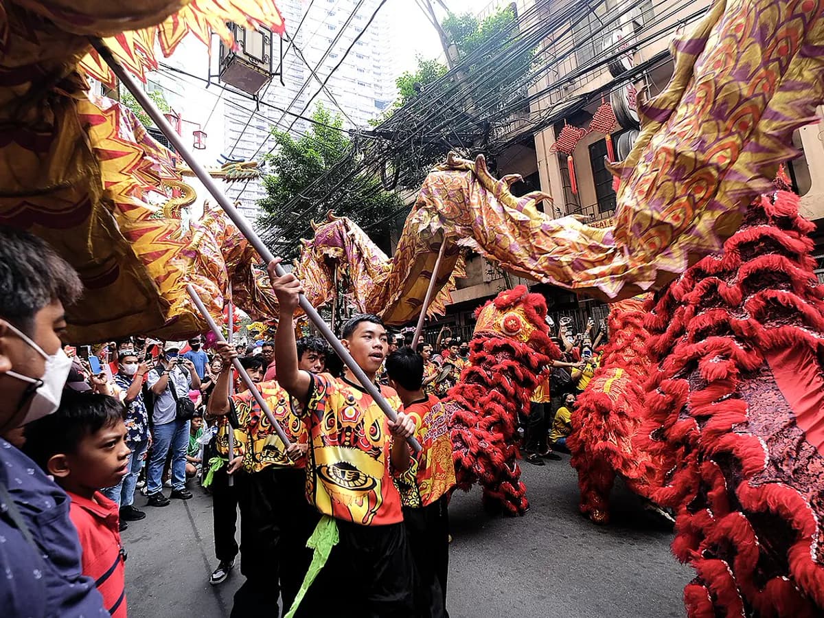 Chinese dragon dance performers carrying a festival dragon