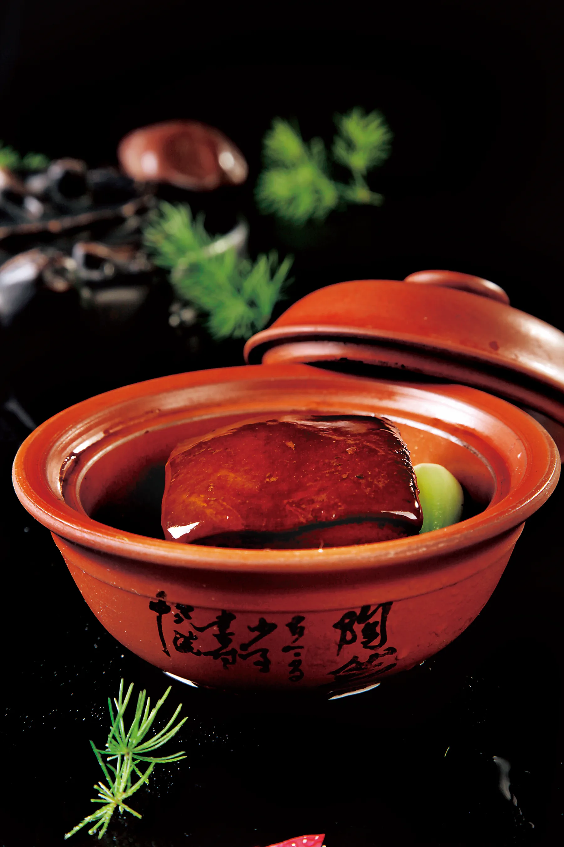 Hangzhou-style Dongpo pork braised until glossy in a red clay pot