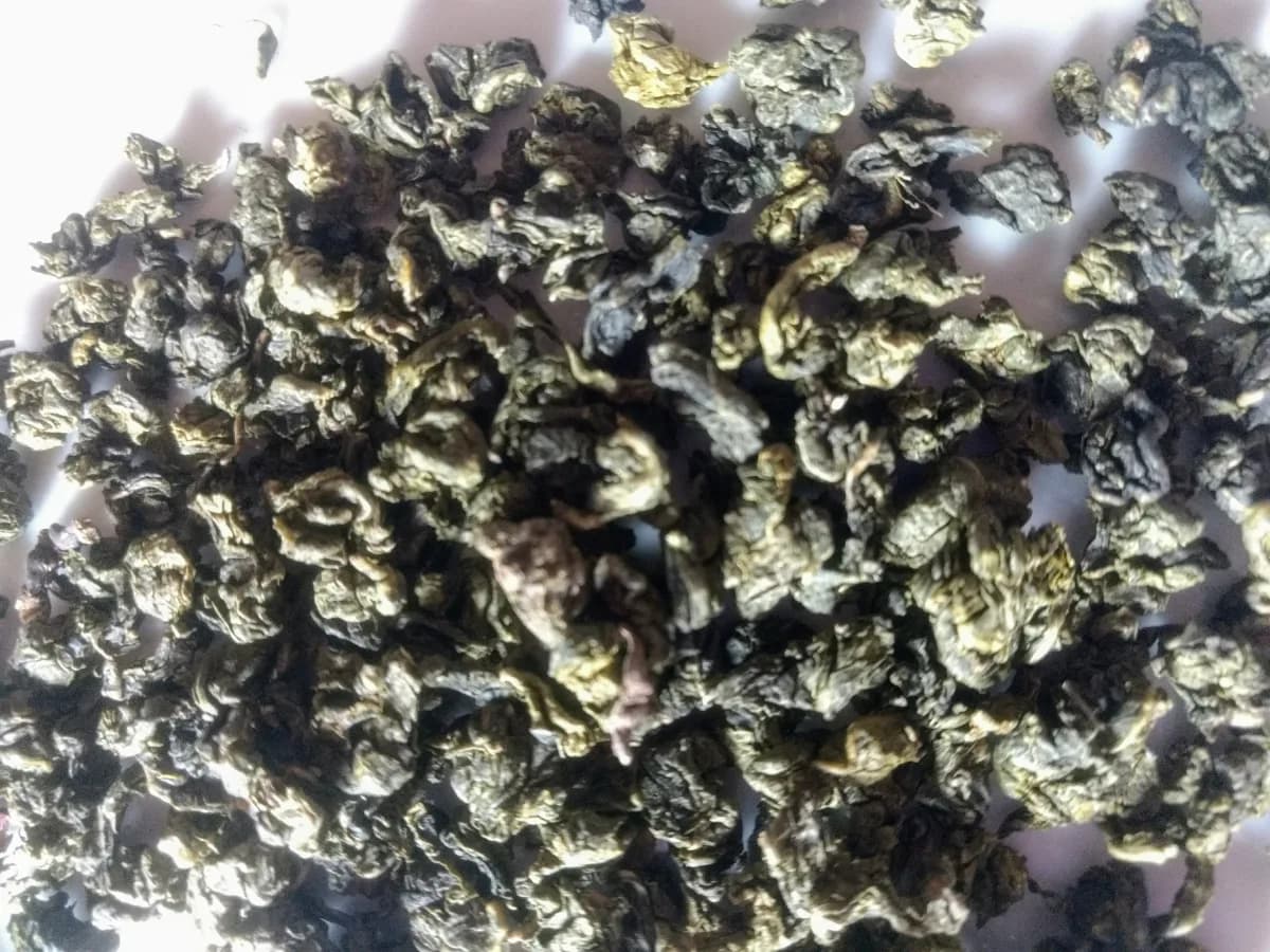Rolled Tieguanyin tea leaves representing Chinese oolong tea