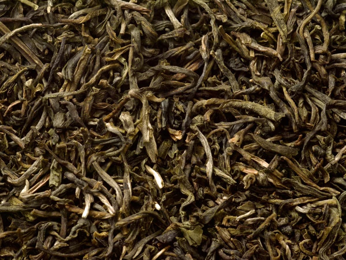 Loose jasmine-scented tea leaves representing Chinese scented tea