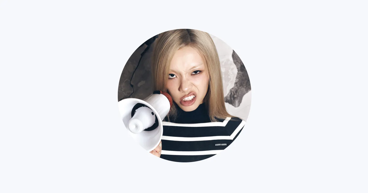 Lexie Liu in her official Apple Music artist portrait holding a megaphone