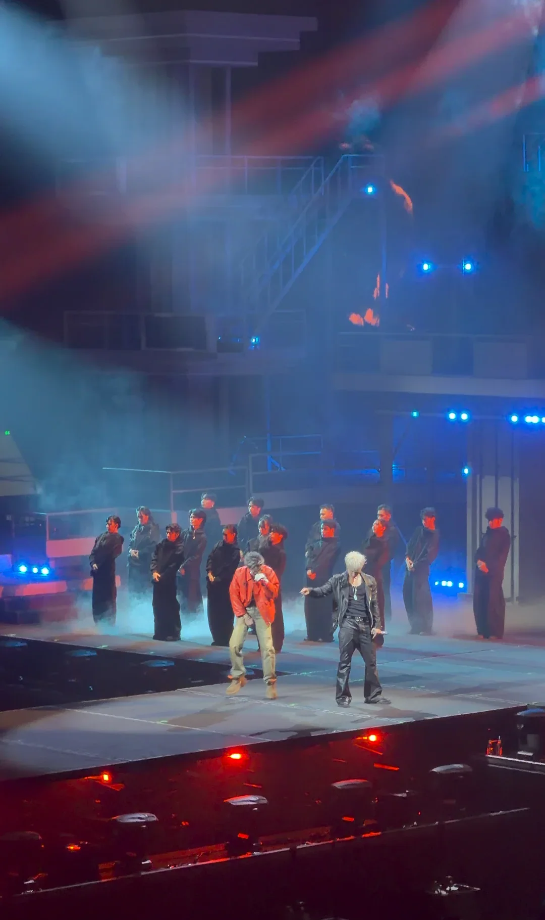 Dylan Wang and Huang Zitao performing on a large live stage