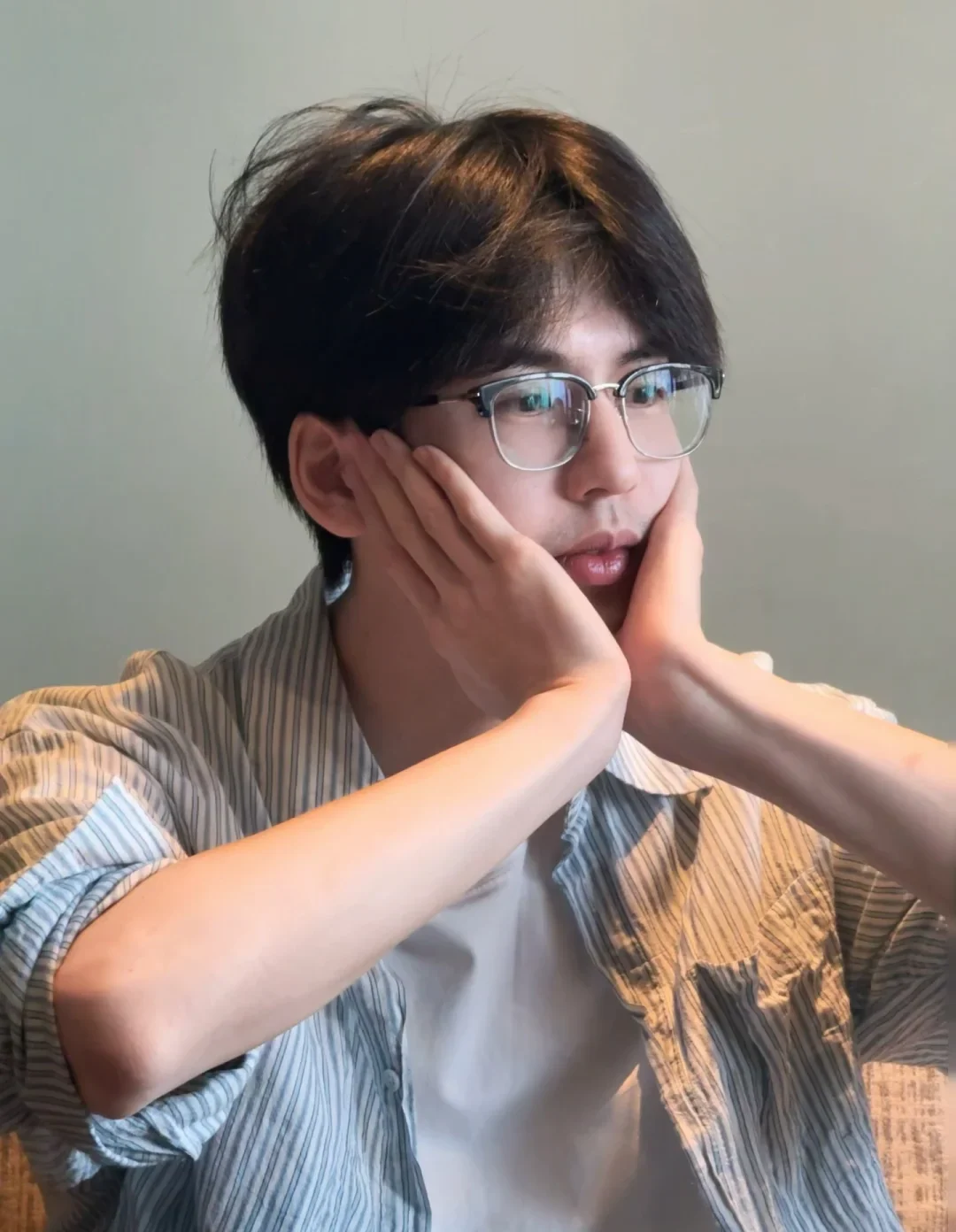 Zhang Linghe in glasses and a striped overshirt in a September 2026 official casual portrait