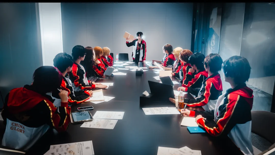 The King's Avatar cosplay team holding a strategy meeting in China Glory uniforms