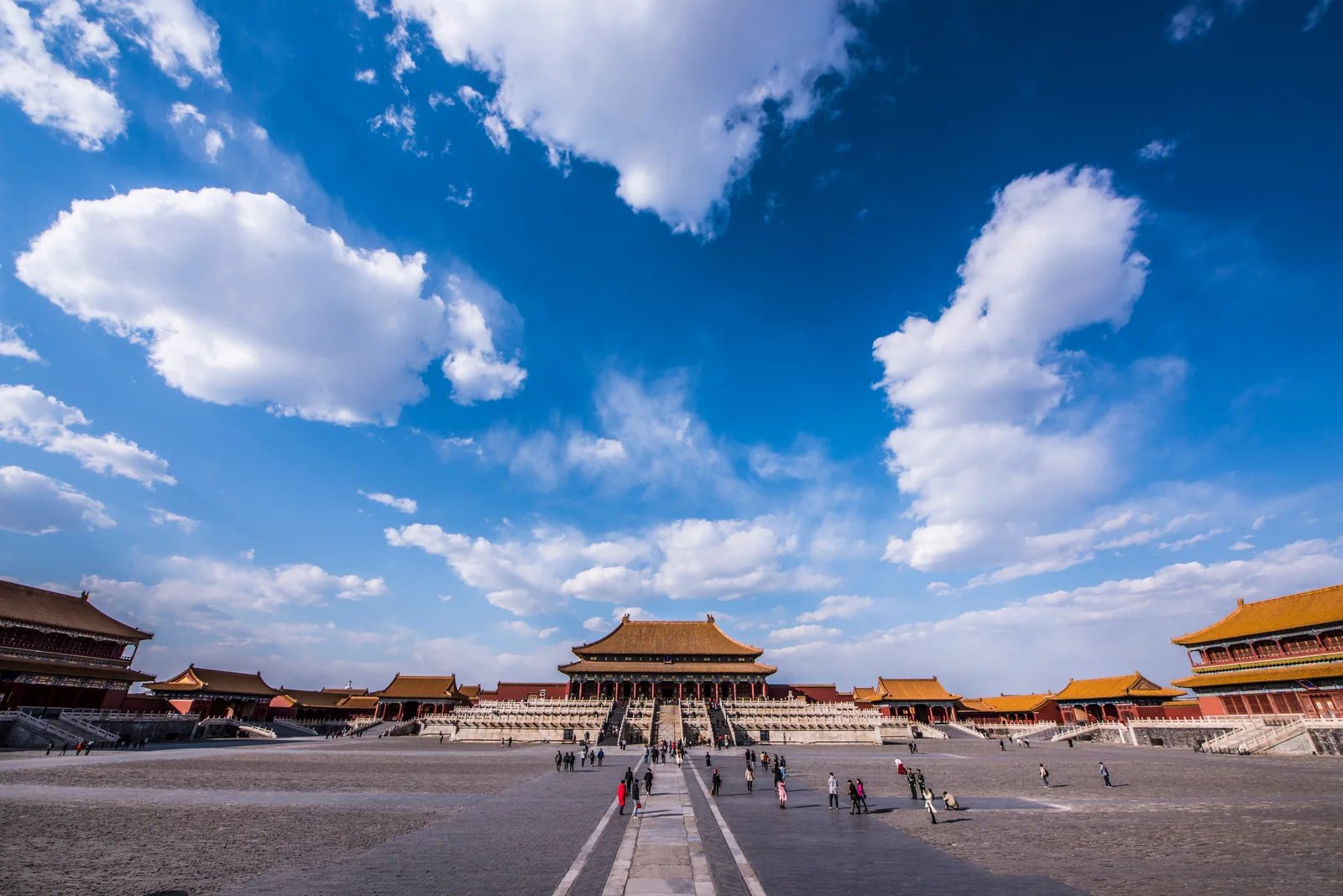 A broad Forbidden City courtyard showing the distance, gates and rooflines that organize imperial movement