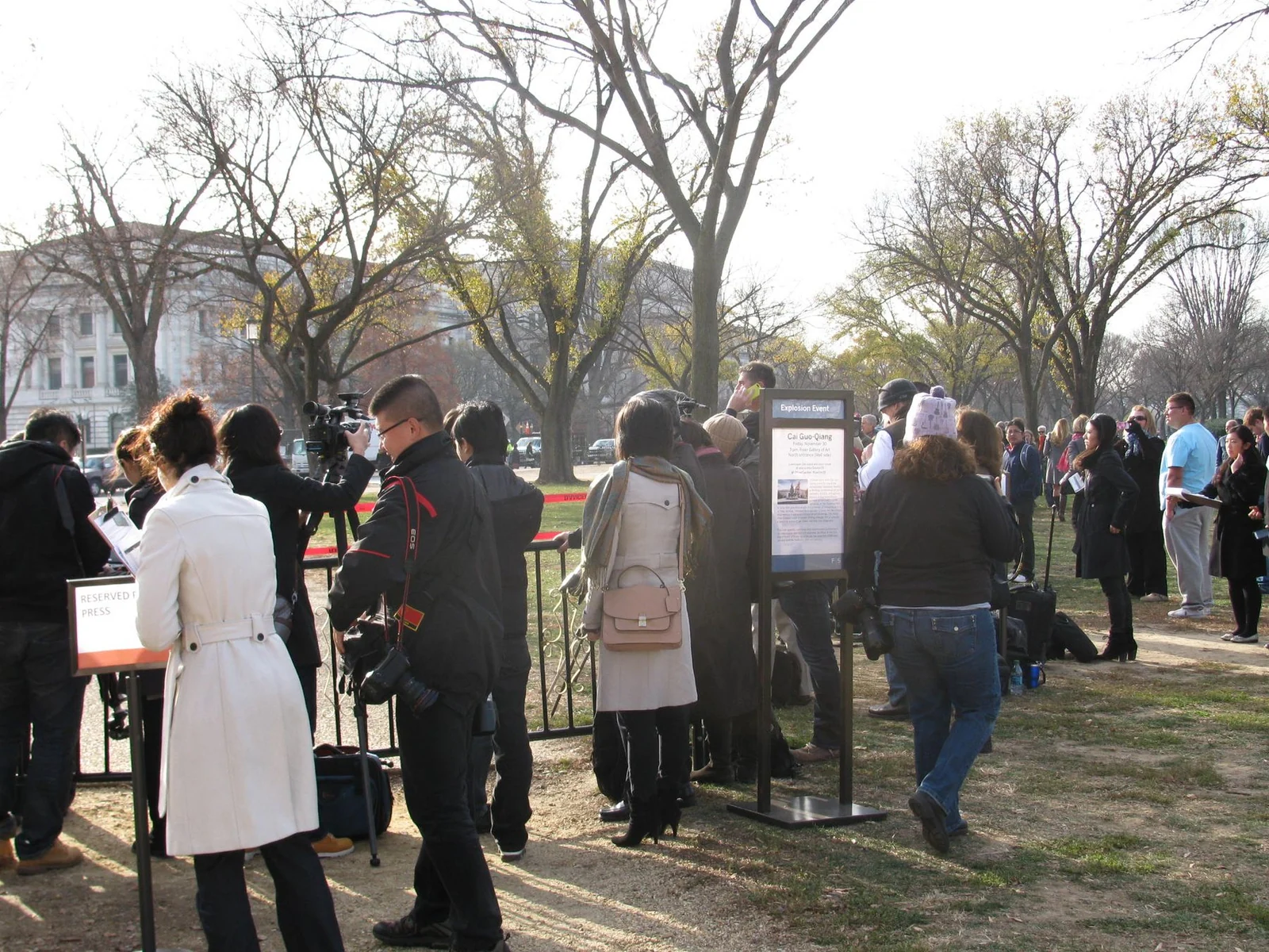 An audience gathering before a Cai Guo-Qiang explosion event, showing time, risk and public expectation around the work