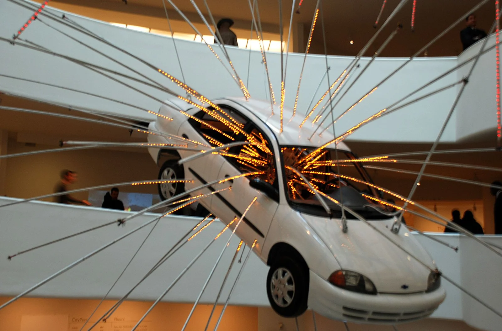 Cai Guo-Qiang's suspended car installation at the Guggenheim turning impact, light, scale and museum space into material evidence