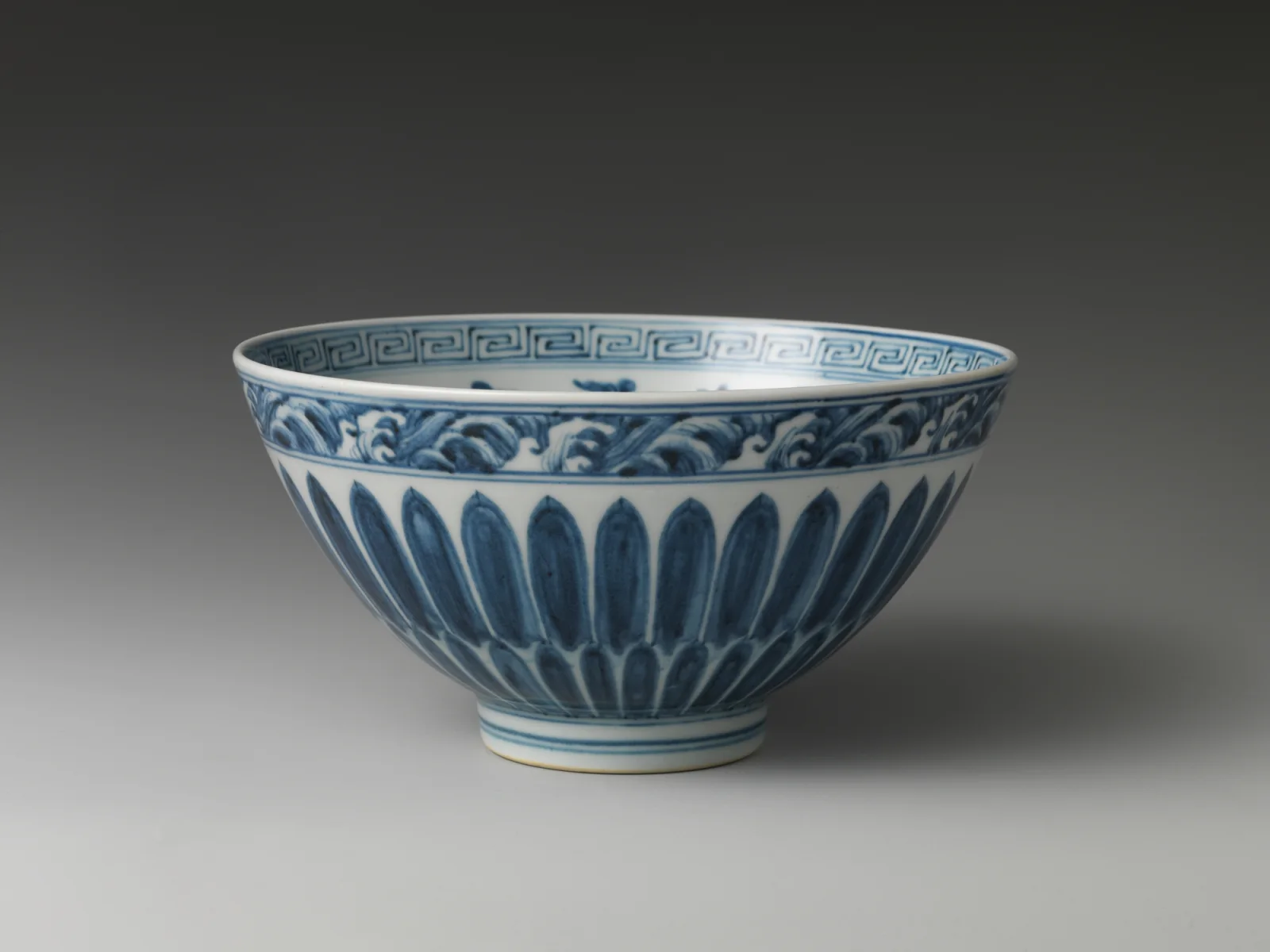 Ming dynasty Chinese blue-and-white porcelain bowl with pomegranates lotus scrolls and chrysanthemum petals