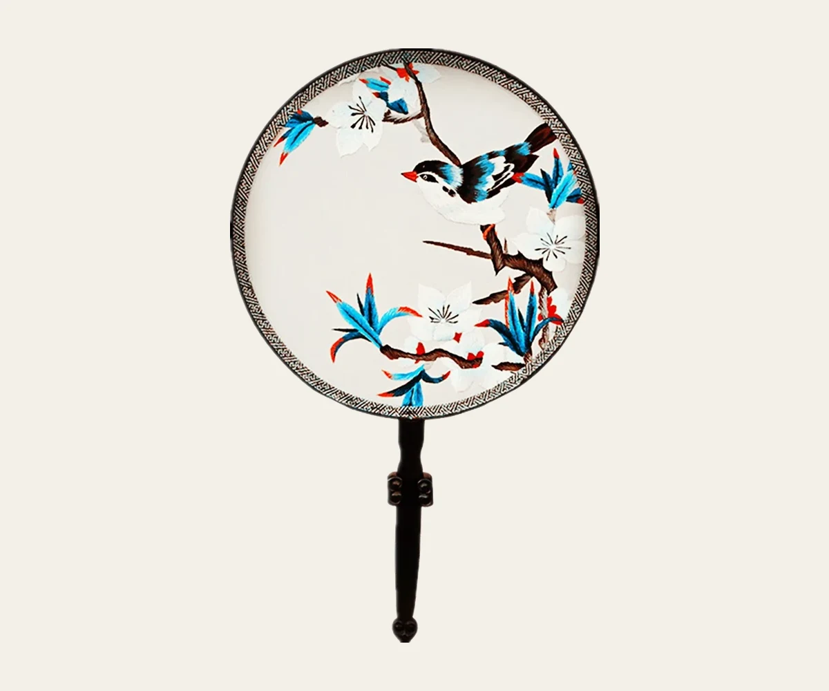 A fixed Chinese round fan with a bird-and-flower design shown for comparison with folding fans