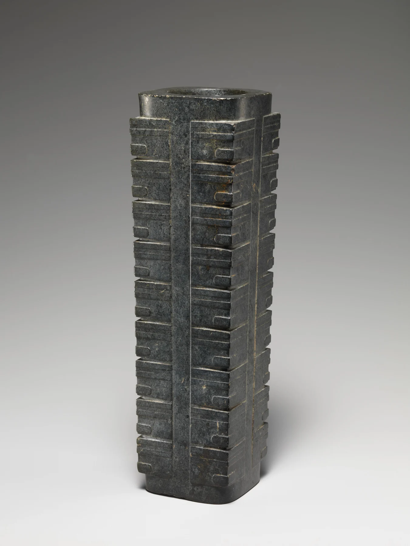 Liangzhu nephrite cong with a tall squared body and circular bore, dated about 2400 BCE