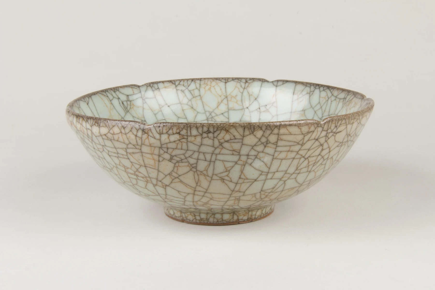 Ge ware bowl with a pale glaze and dark crackle seen across the interior and exterior