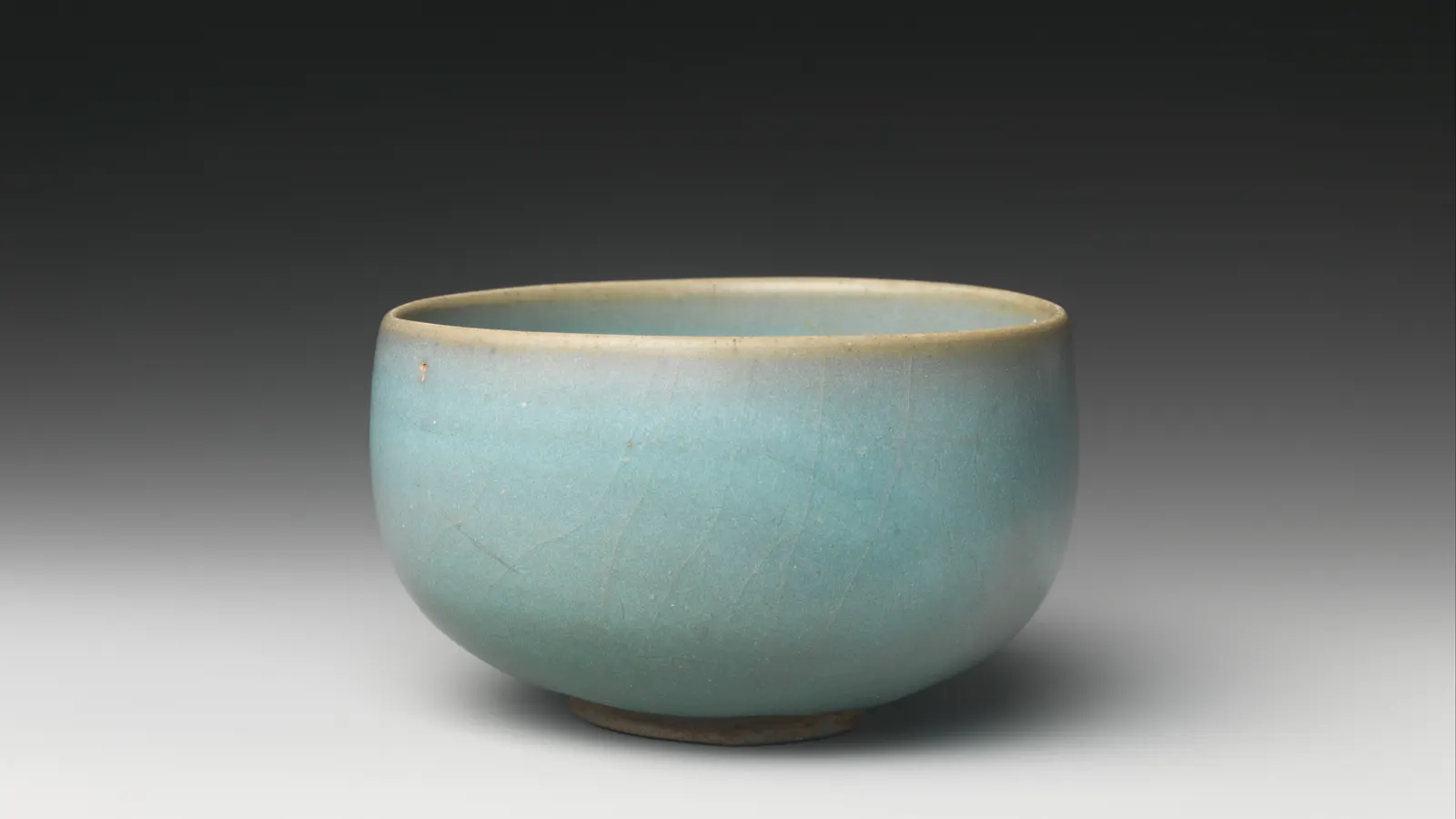 Northern Song Jun ware bowl covered in a deep opalescent blue glaze