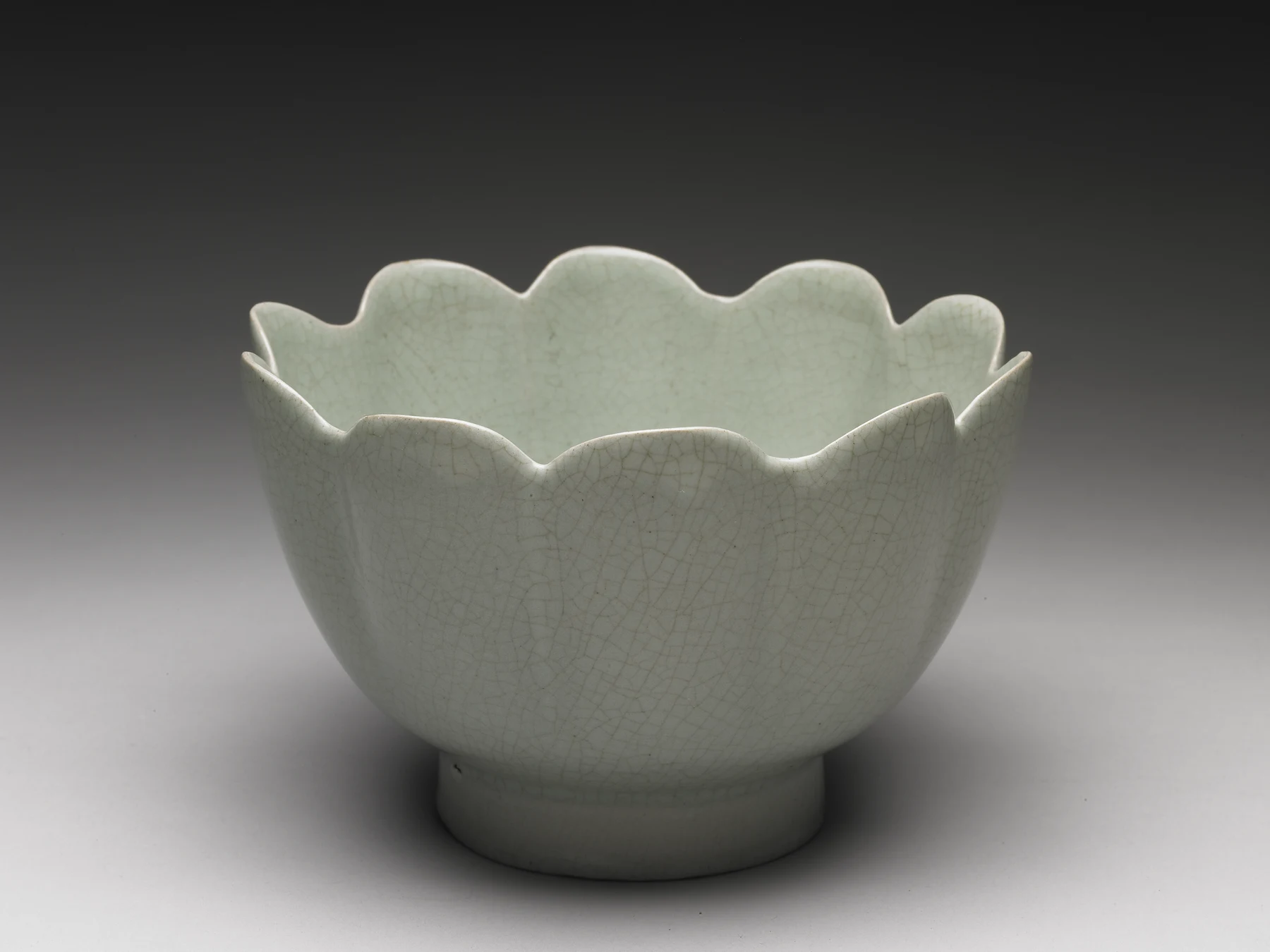 Northern Song Ru ware lotus-shaped warming bowl with a pale celadon glaze and petal-lobed wall