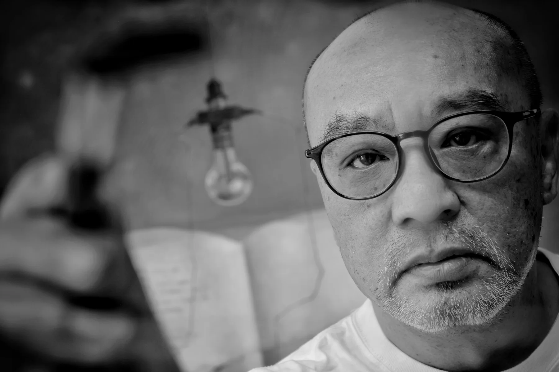 Zhang Xiaogang seated for an identified portrait in Beijing in 2025