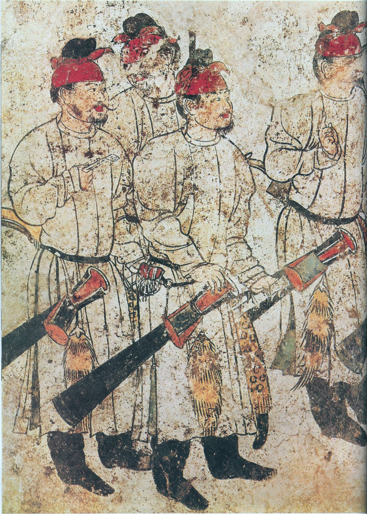 Male attendants in a Tang dynasty tomb cortege wearing belted robes and headwear