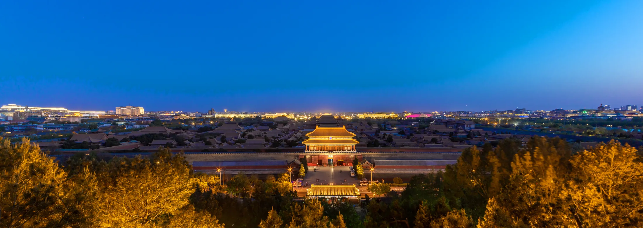 The Forbidden City and central Beijing glowing after sunset, viewed from Jingshan