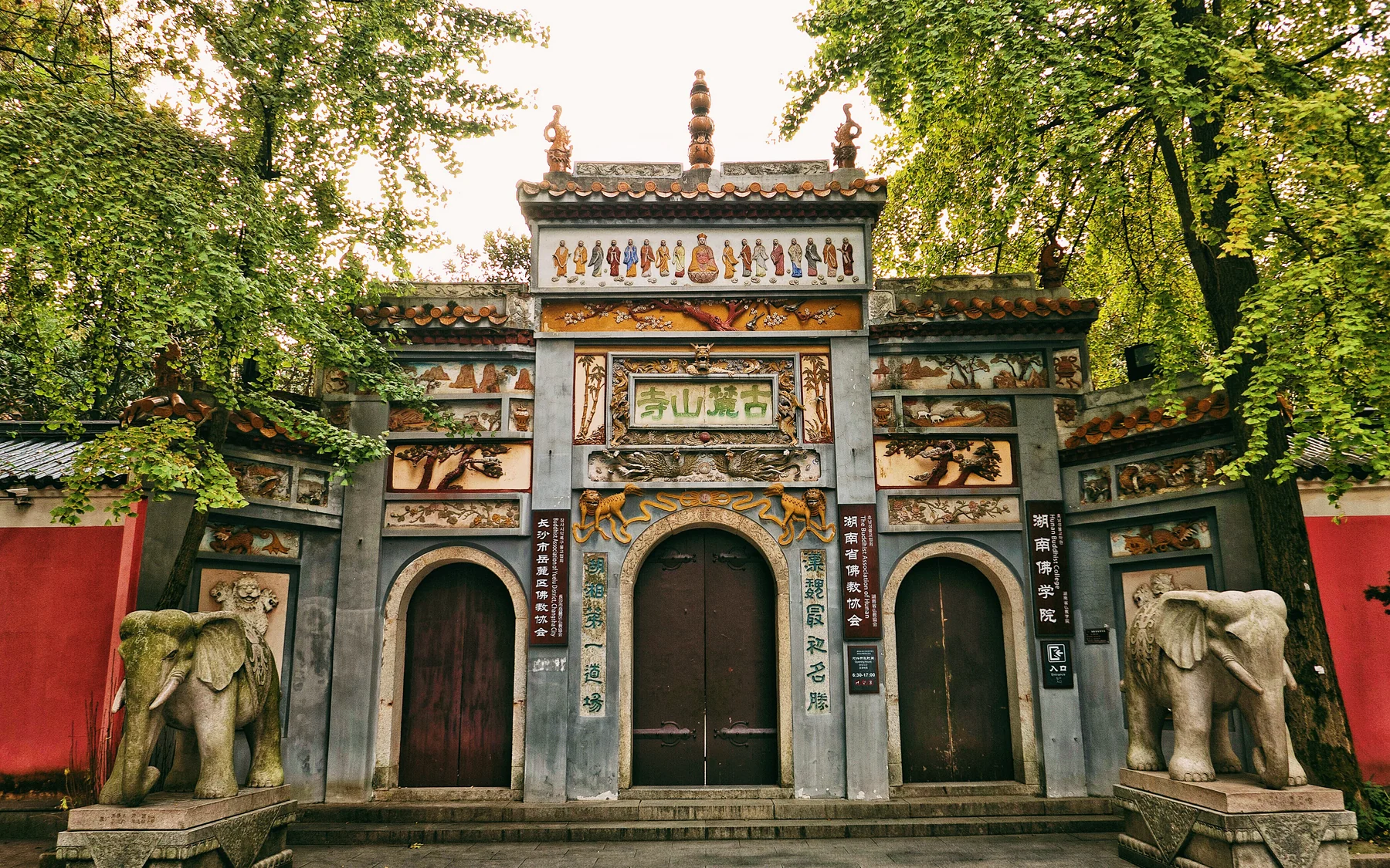 Ancient Lushan Temple in Changsha, framed by trees and layered rooflines