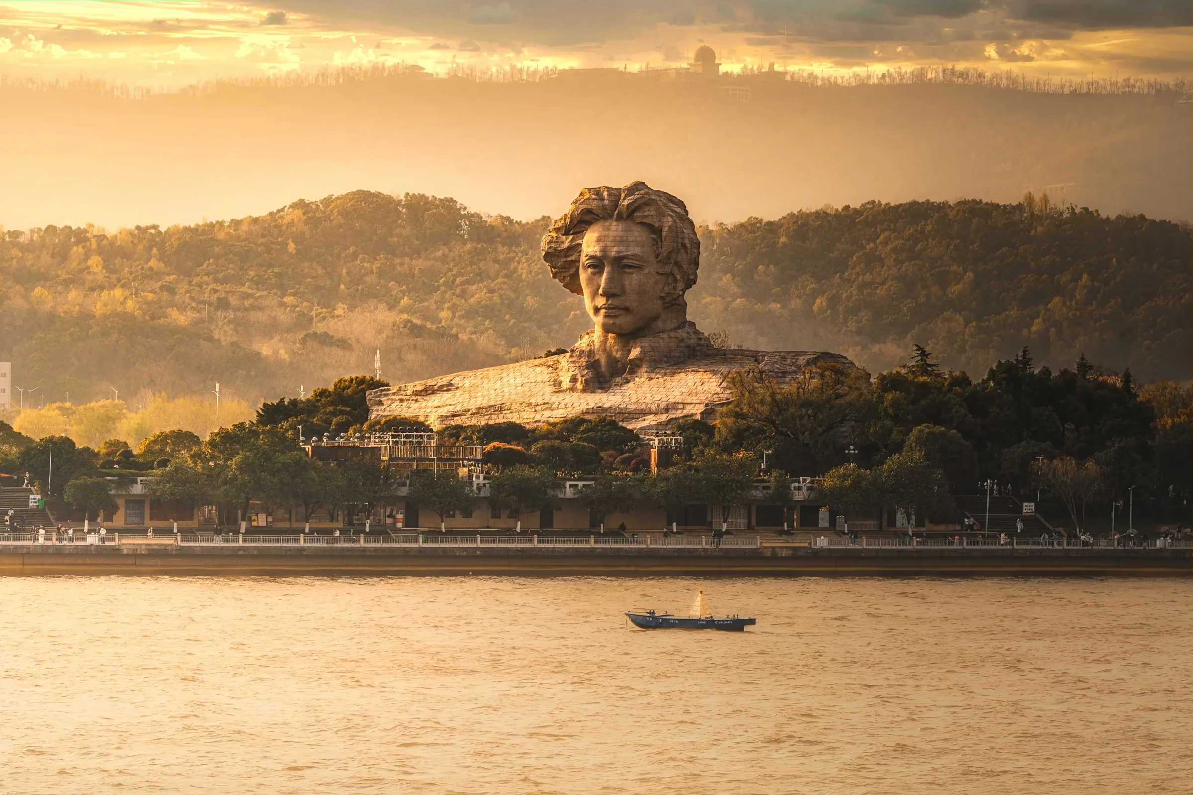 Young Mao Zedong monument on Orange Isle beside the Xiang River in Changsha at golden hour