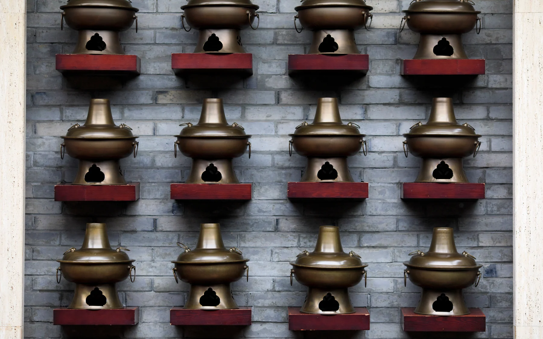 Traditional cooking vessels arranged in a Chengdu hot-pot kitchen