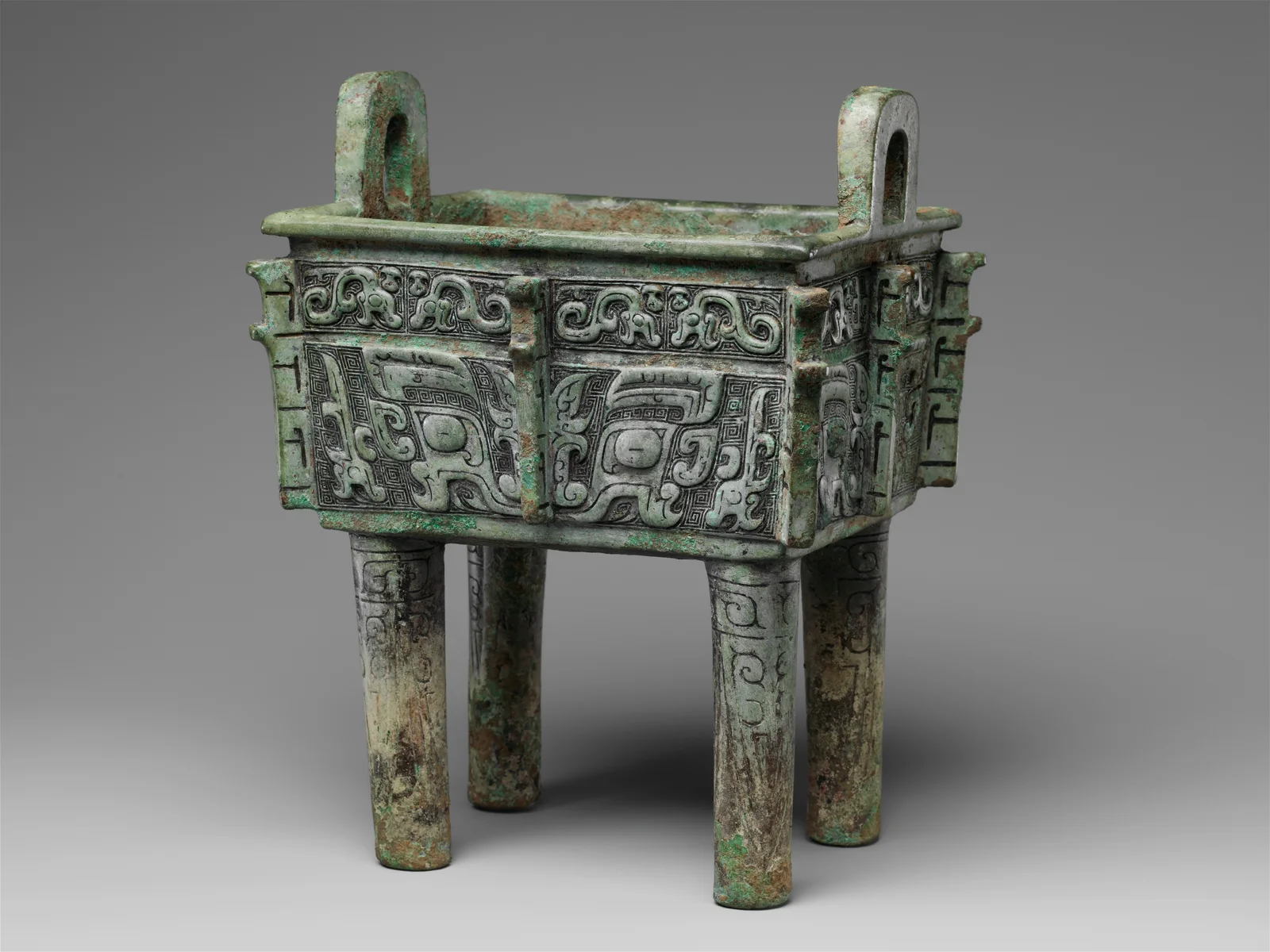 Shang dynasty bronze fangding with large animal-mask motifs associated with taotie