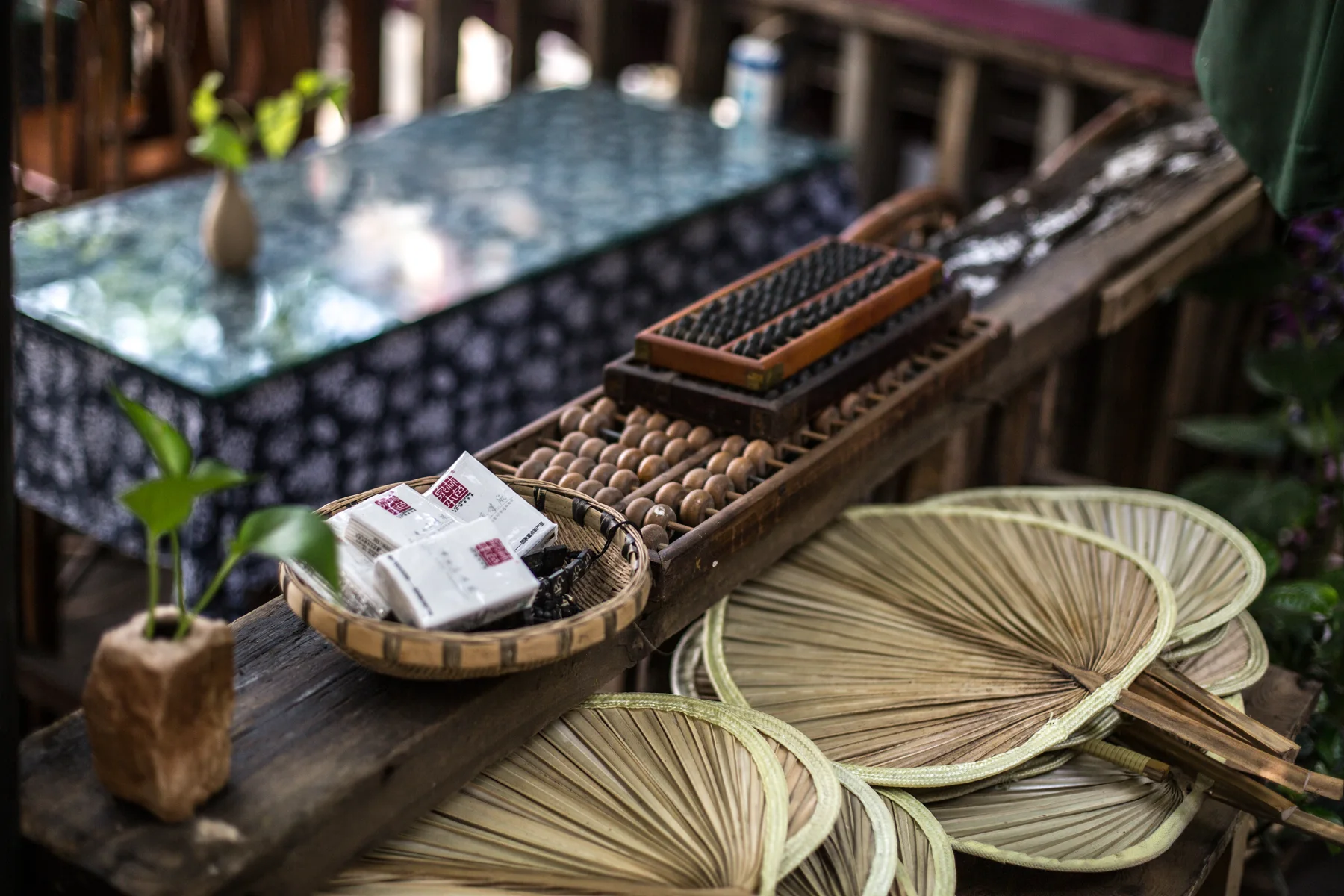 Tea and small craft objects arranged on a traditional Chongqing table