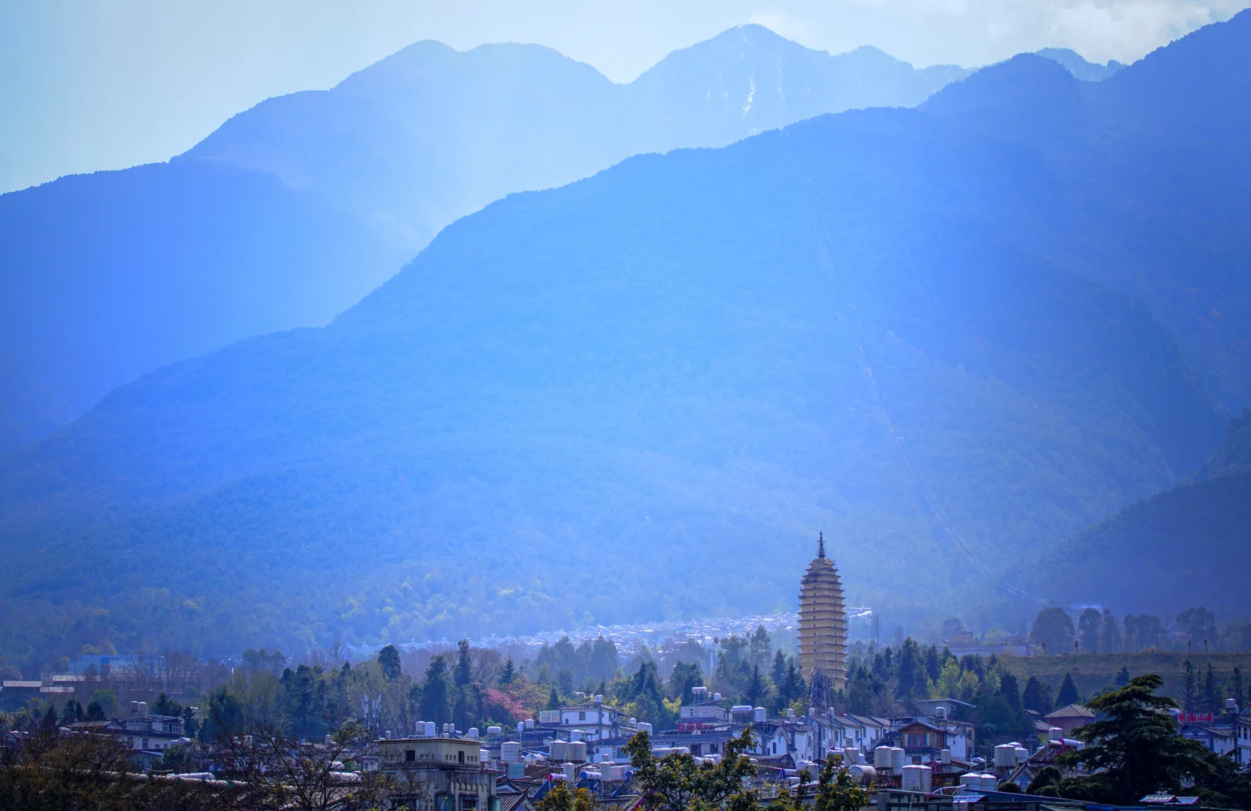 Cangshan ridges rising above the Dali basin and a distant pagoda