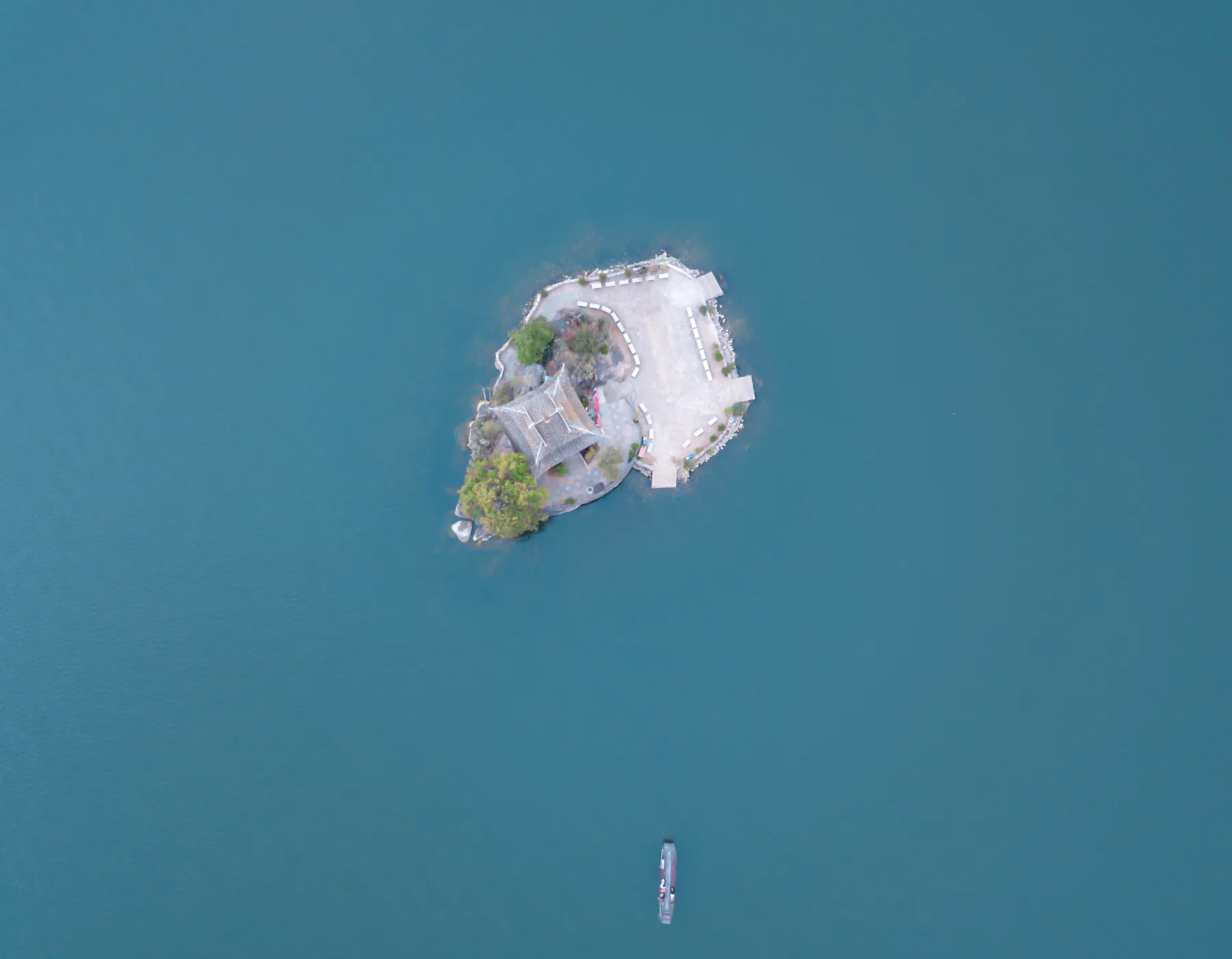 Small Putuo Island surrounded by the blue water of Erhai from above