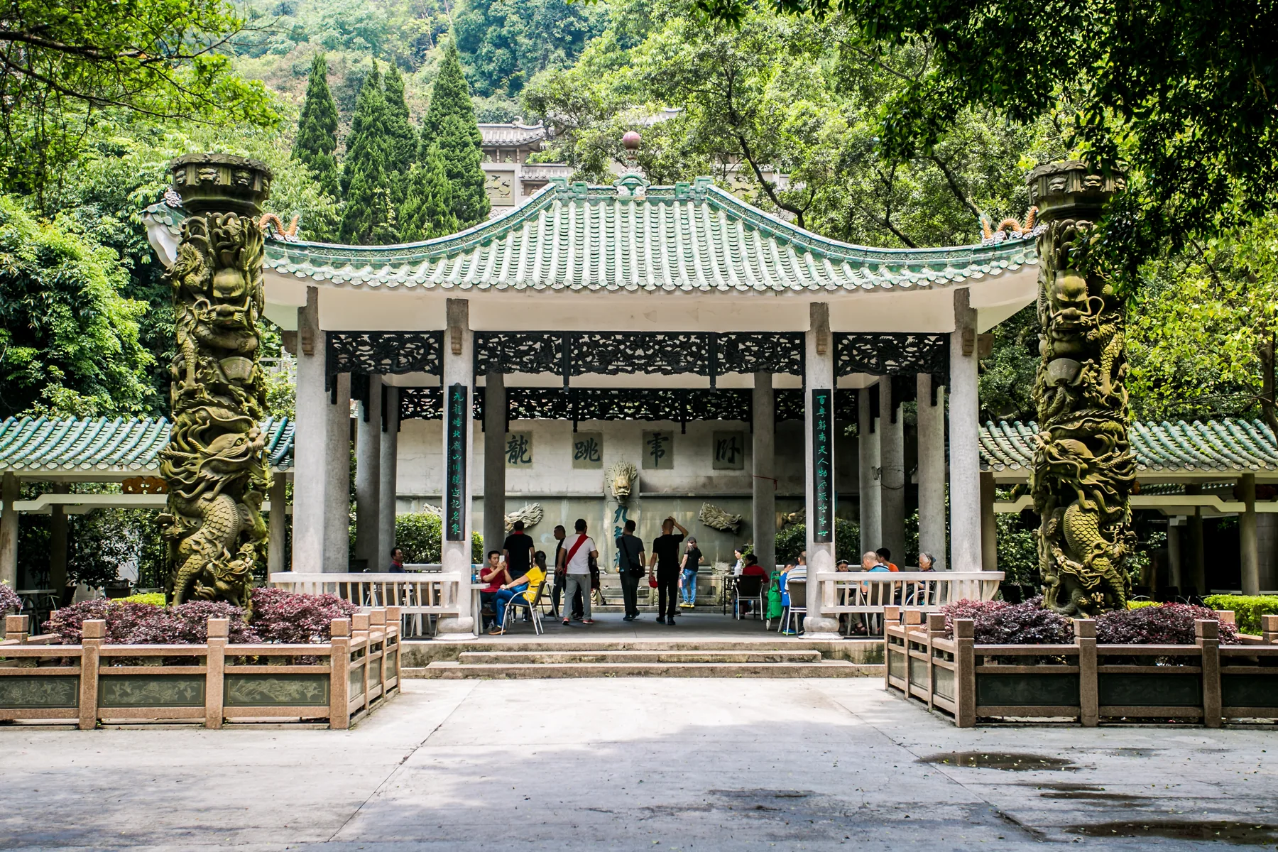 Visitors read carved inscriptions inside Guangzhou's stele forest