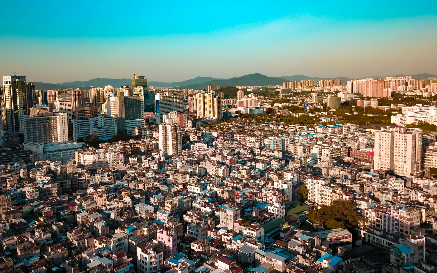 Aerial view of Shipai Village pressed against Guangzhou's high-rise city fabric