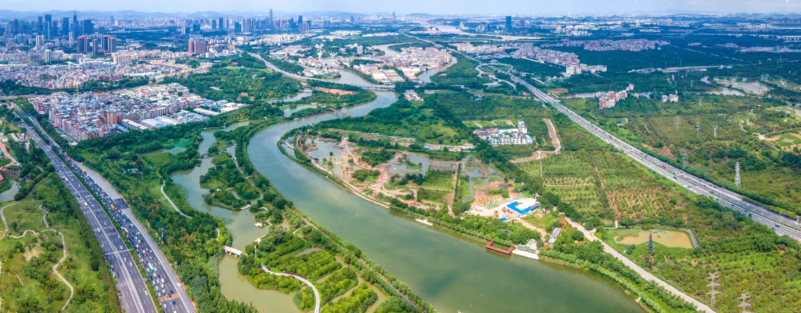 Aerial panorama of waterways, orchards and paths in Haizhu Wetland, Guangzhou