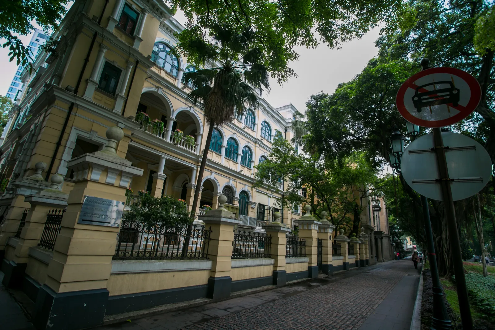Historic buildings and mature trees along a quiet street on Shamian Island