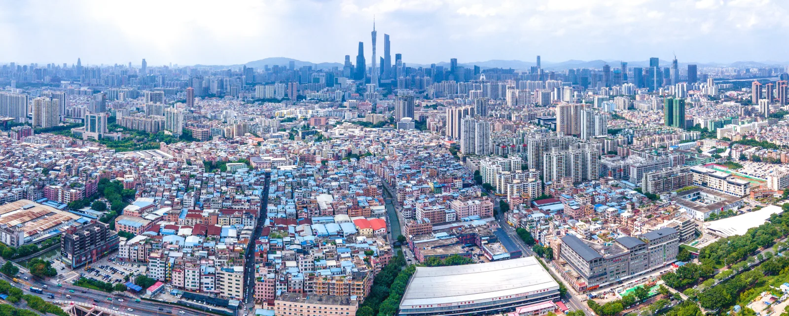Dense Datang urban village beside modern high-rise development in Guangzhou