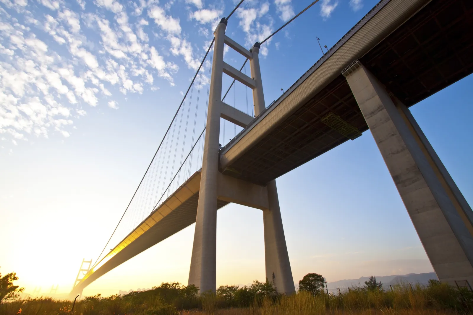 Tsing Ma suspension bridge crossing between islands at sunset