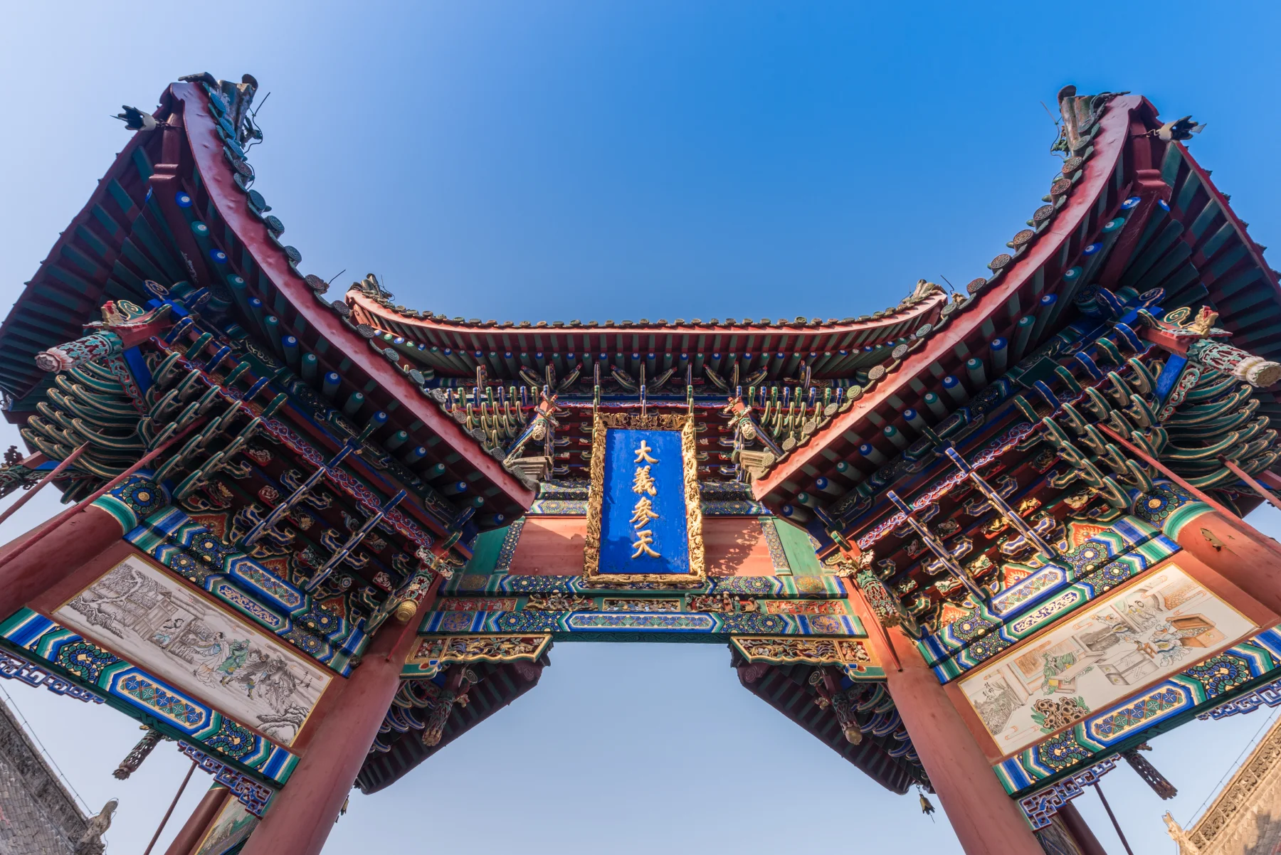Colorful roof brackets and carved architectural detail at Shanshangan Guild Hall