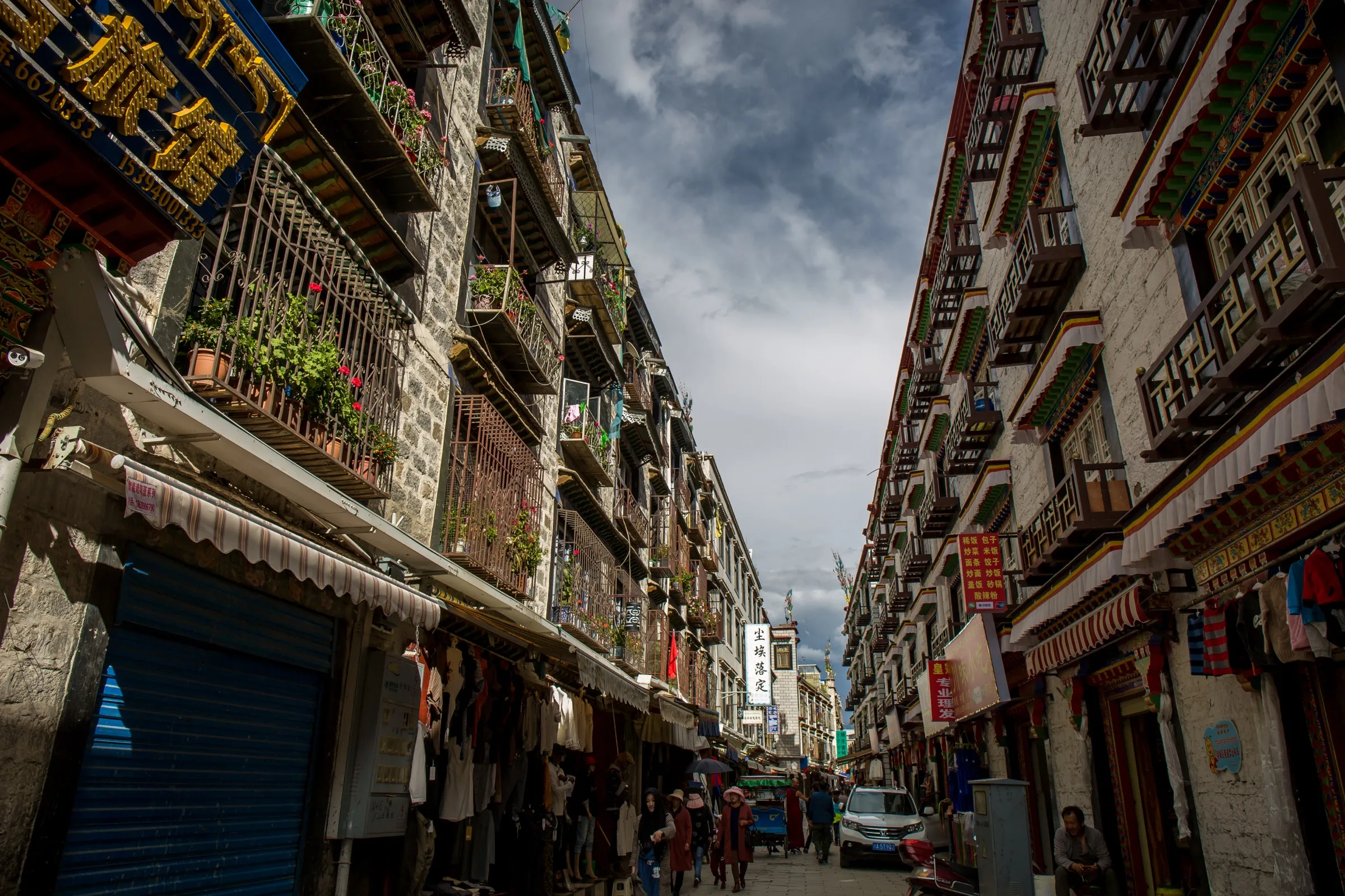 Dense commercial street and everyday urban life in Lhasa