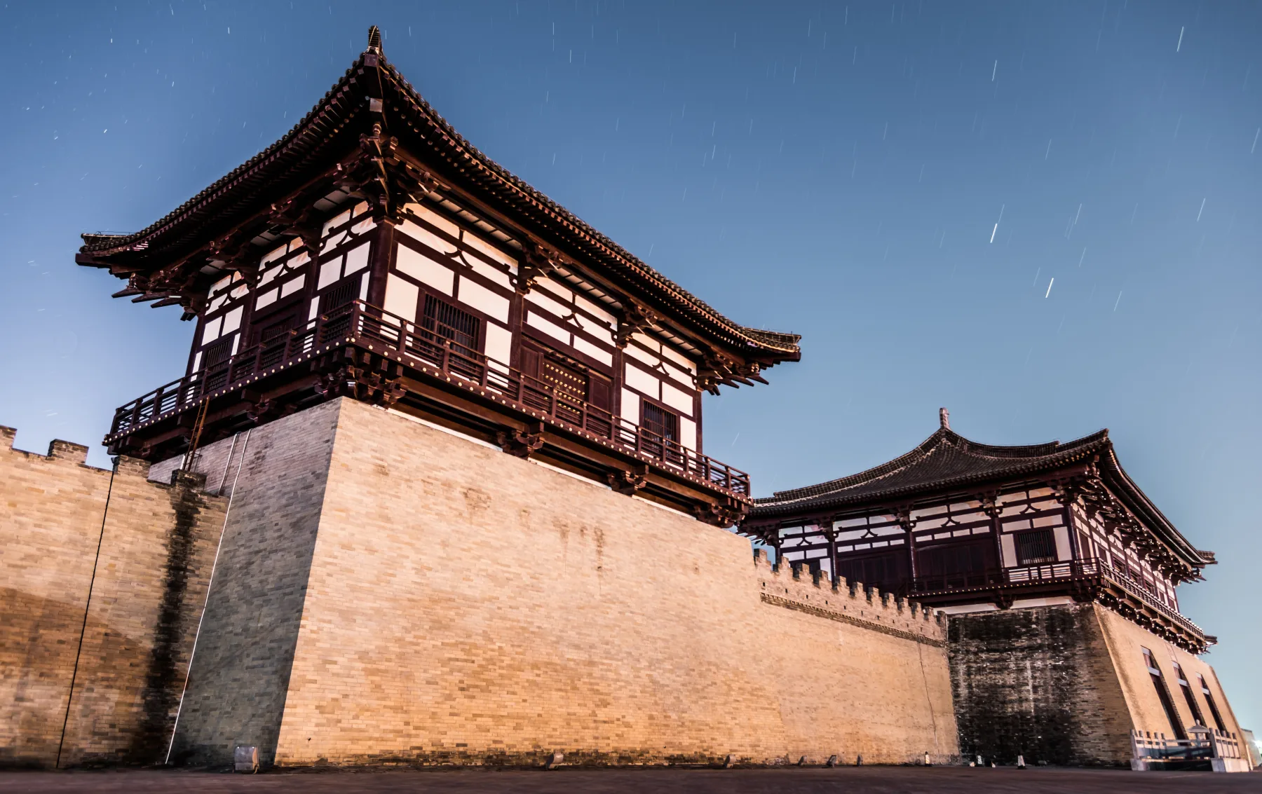The reconstructed Dingding Gate presentation illuminated at blue hour
