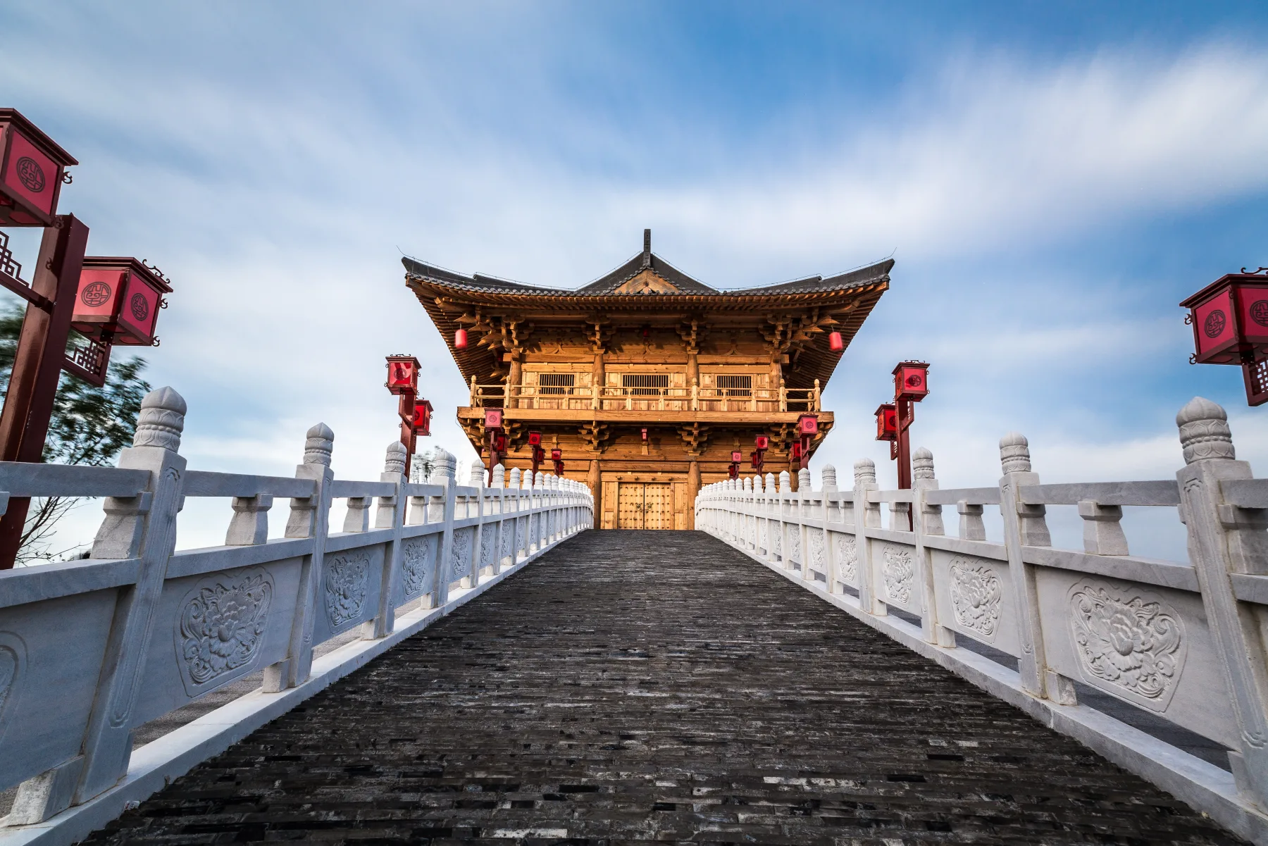 Bridge, water and reconstructed architecture at the Jiuzhou Pool heritage landscape