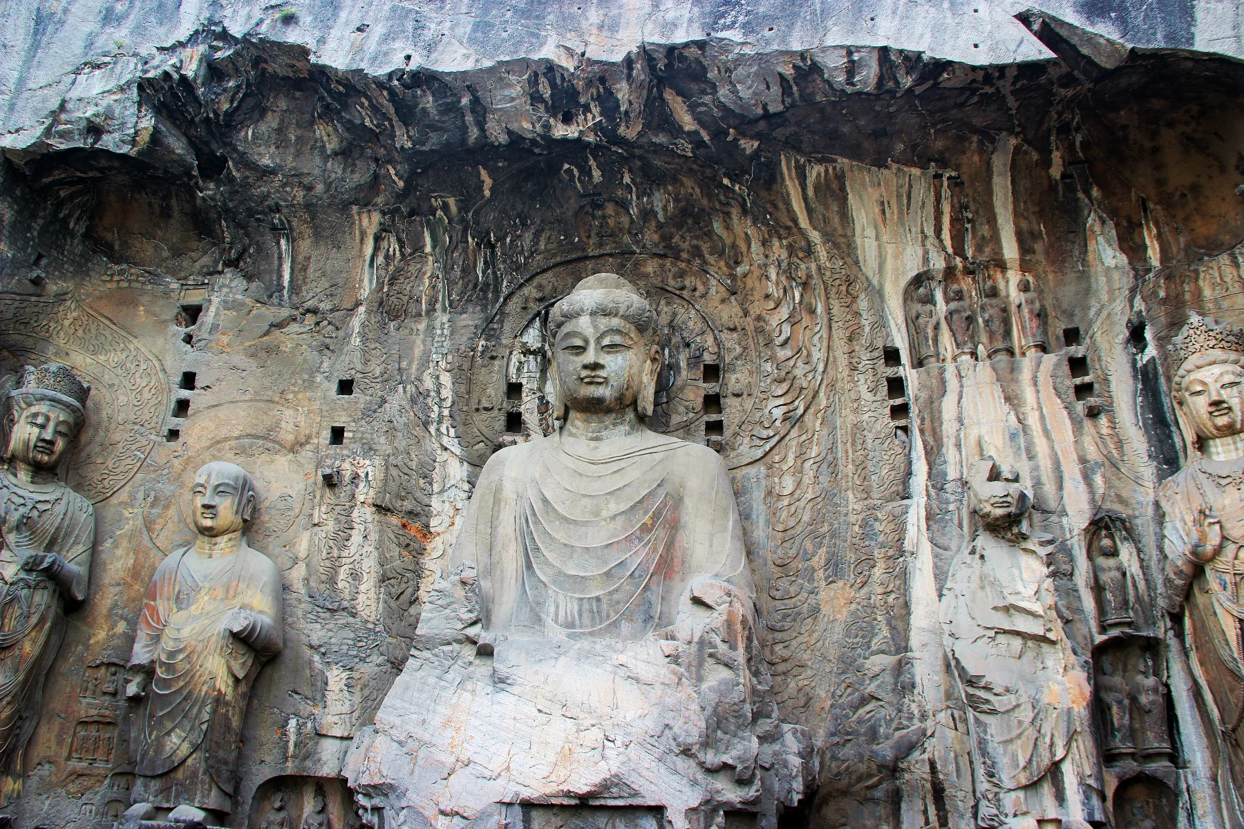 The monumental Vairocana Buddha and surrounding carvings at Longmen Grottoes