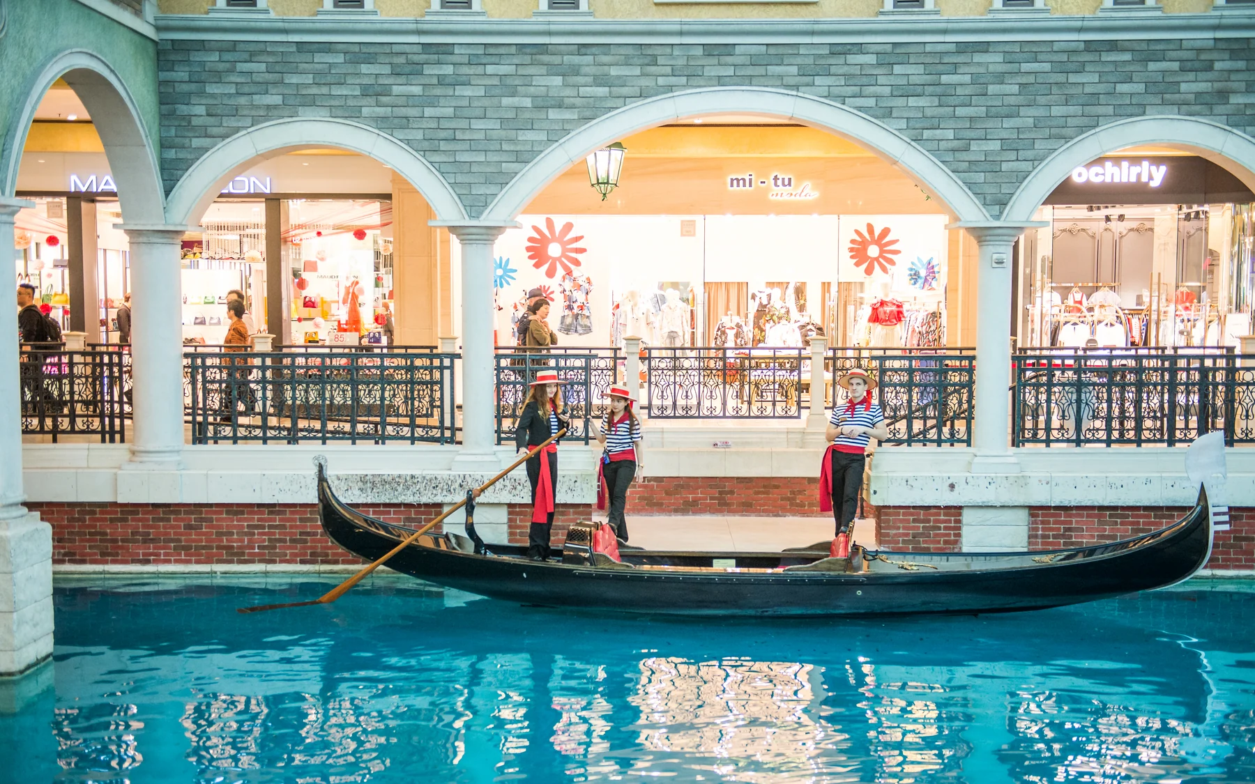 The Venetian Macau interior, an enclosed resort world beside older village-scale streets