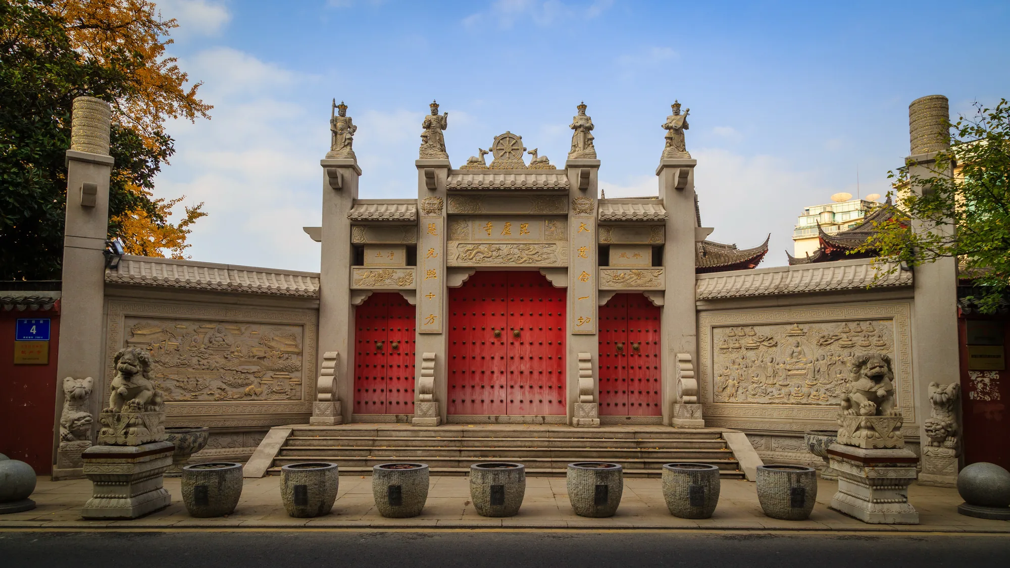 A quieter side courtyard framed by temple buildings at Pilu Temple