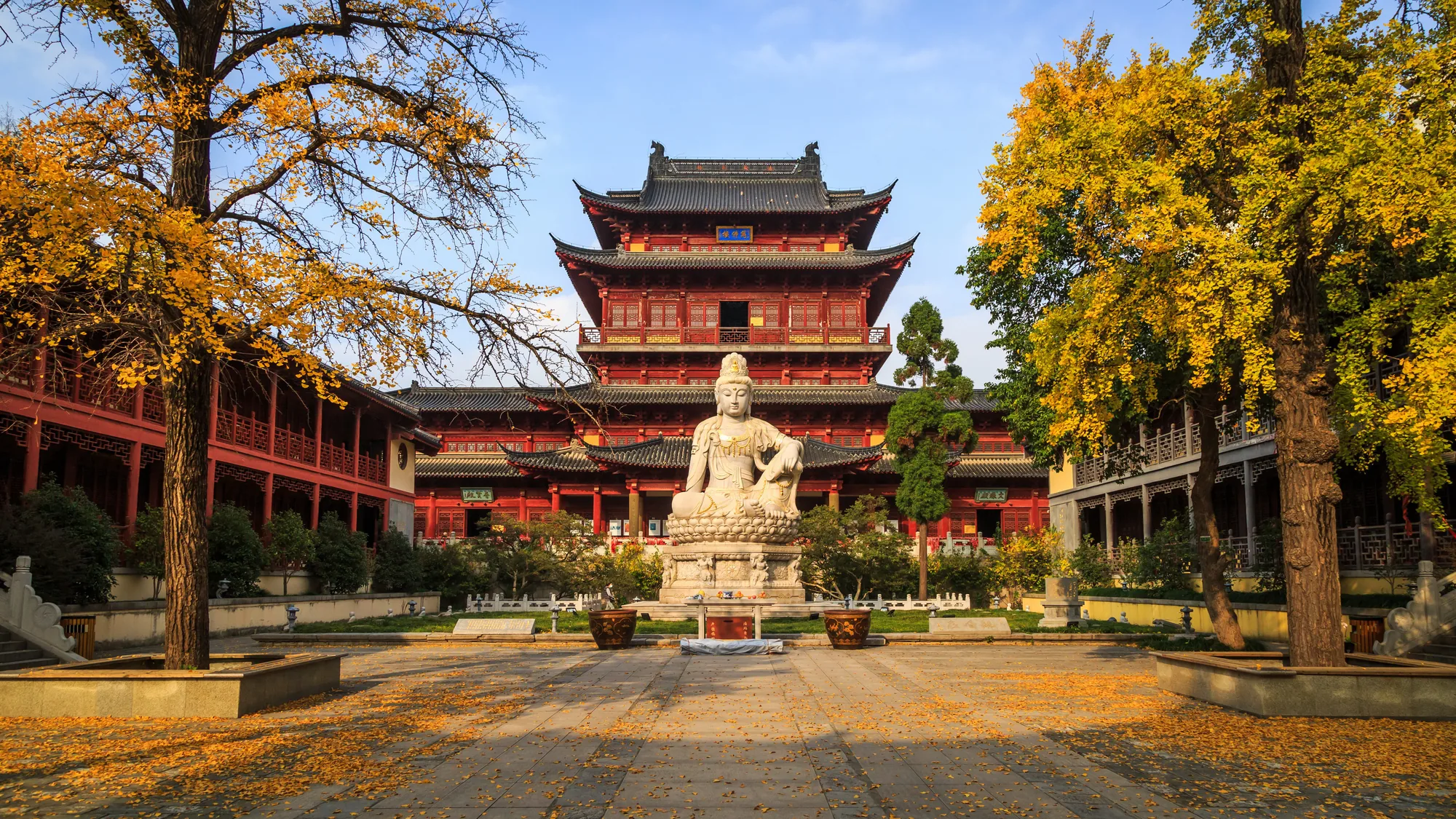 A large timber hall and open courtyard at Pilu Temple