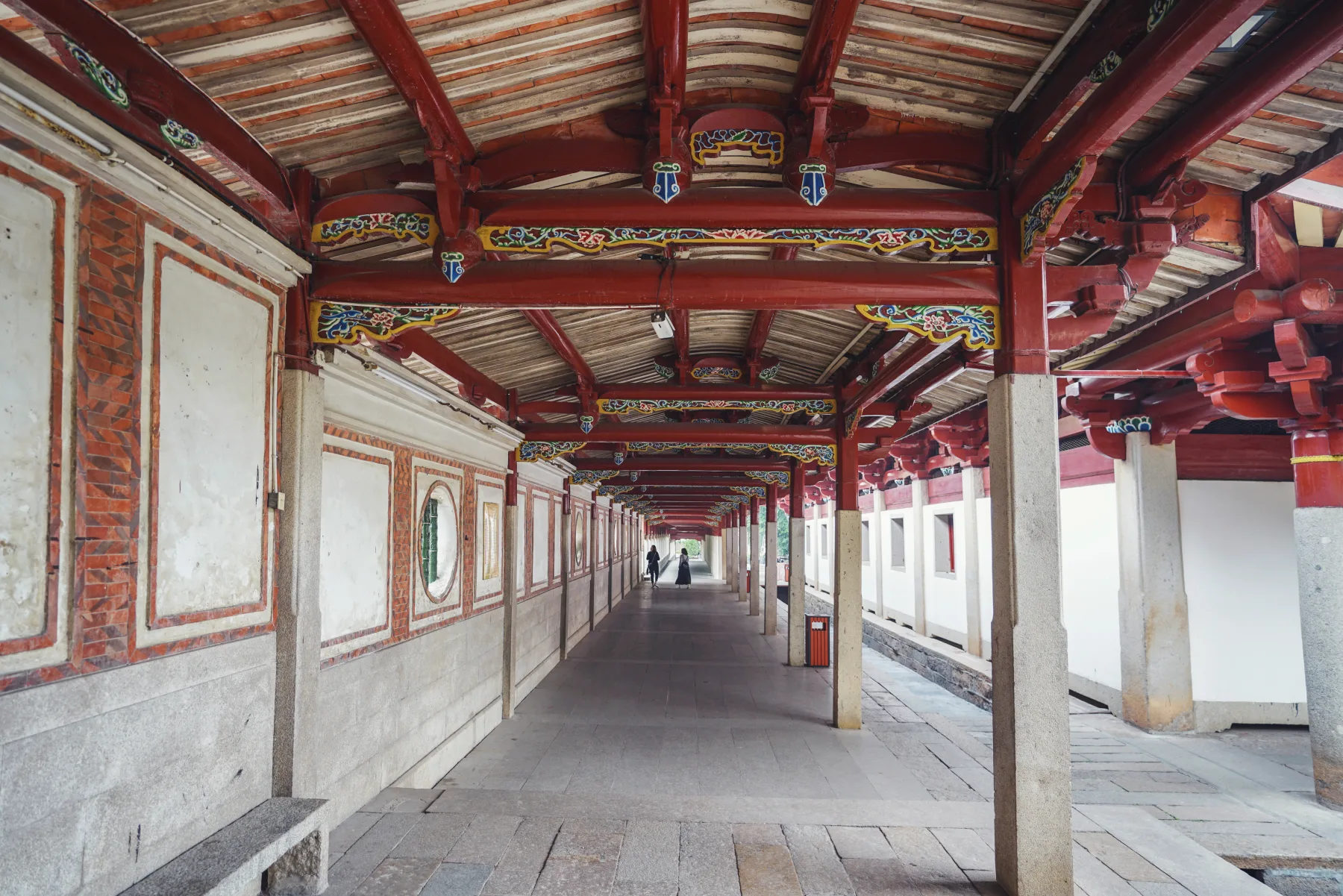 Detailed stone pagoda at Kaiyuan Temple against a blue sky
