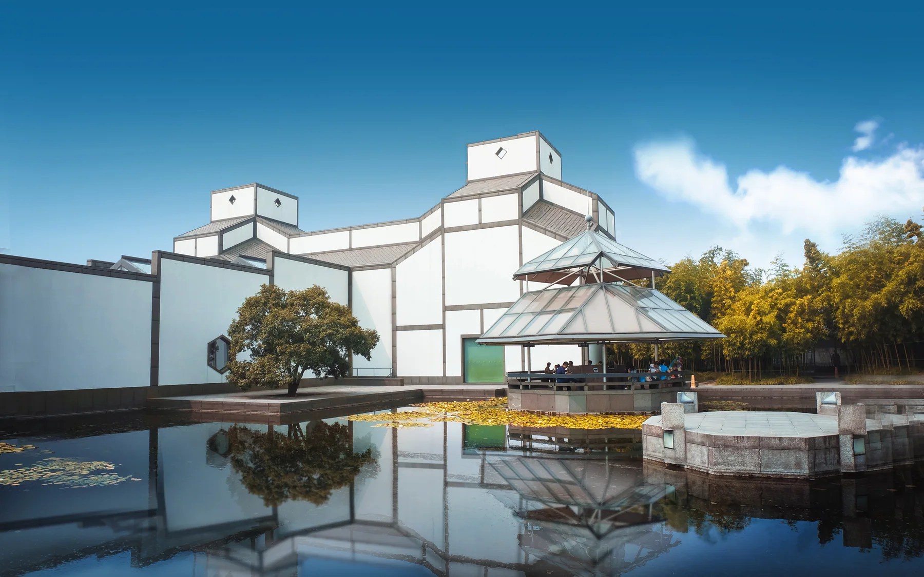 Suzhou Museum courtyard showing a modern architectural conversation with white walls, water and garden space