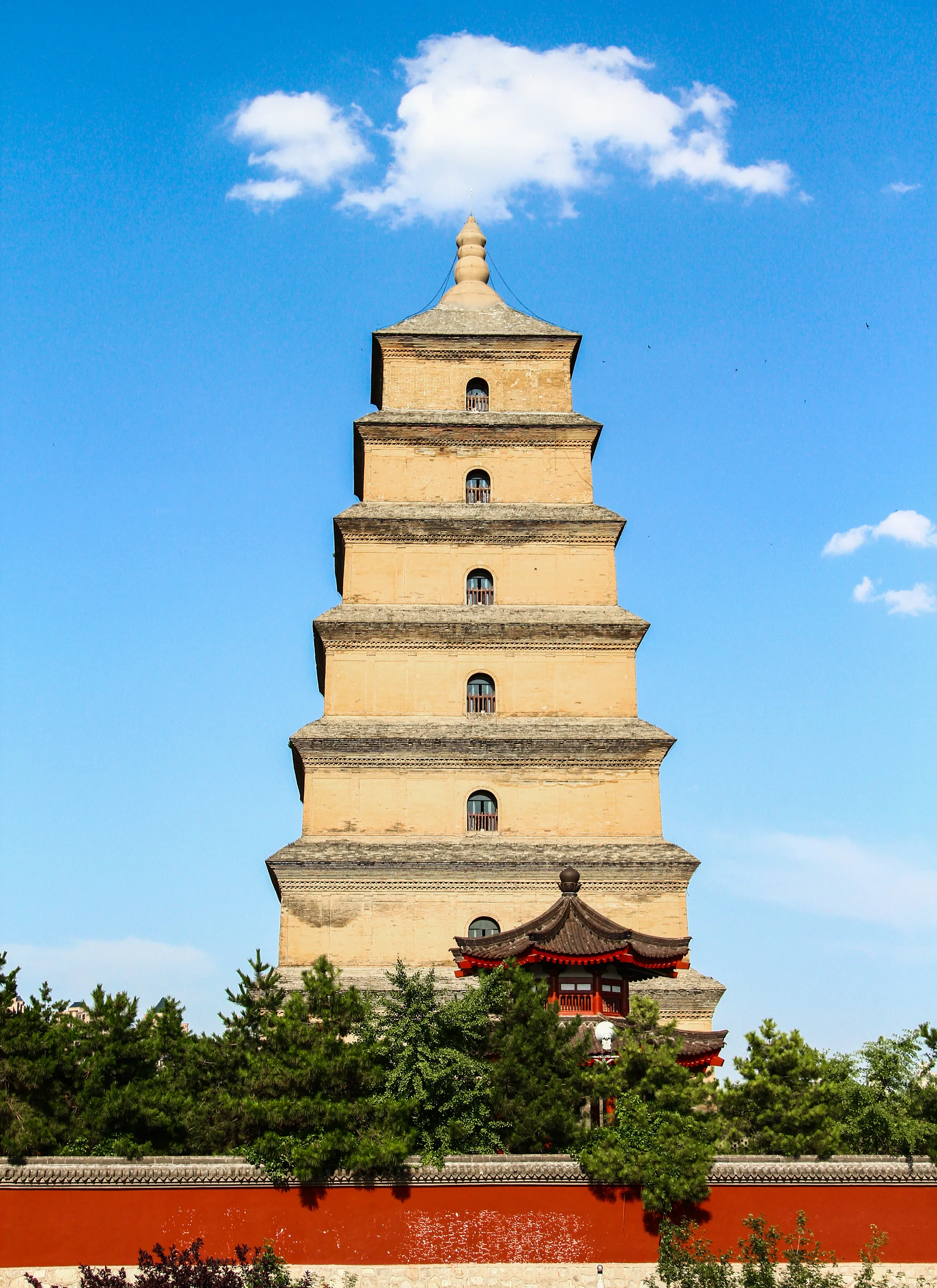 The brick Big Wild Goose Pagoda rising behind temple walls and trees