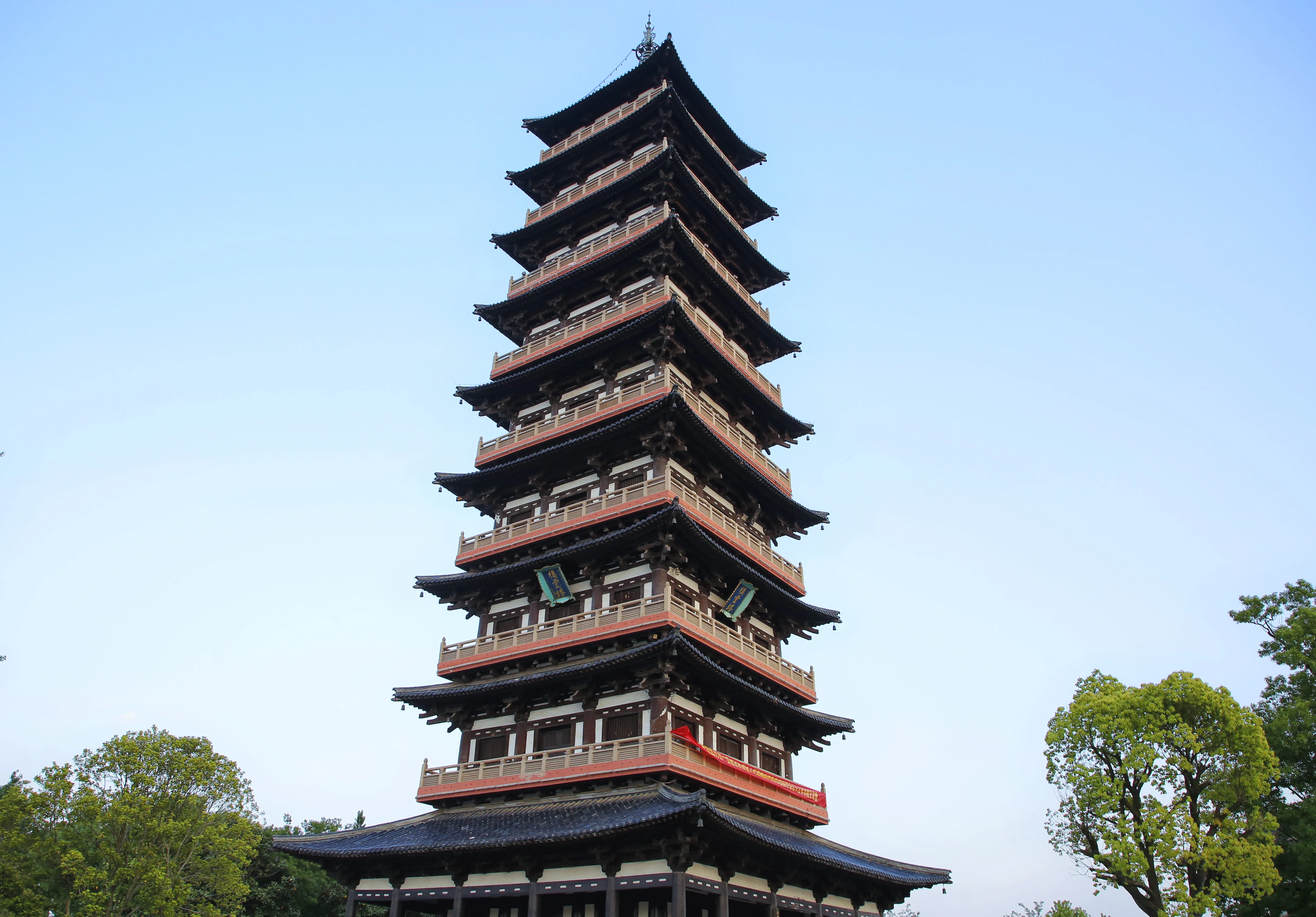 The pagoda at Daming Temple rising above trees and temple roofs