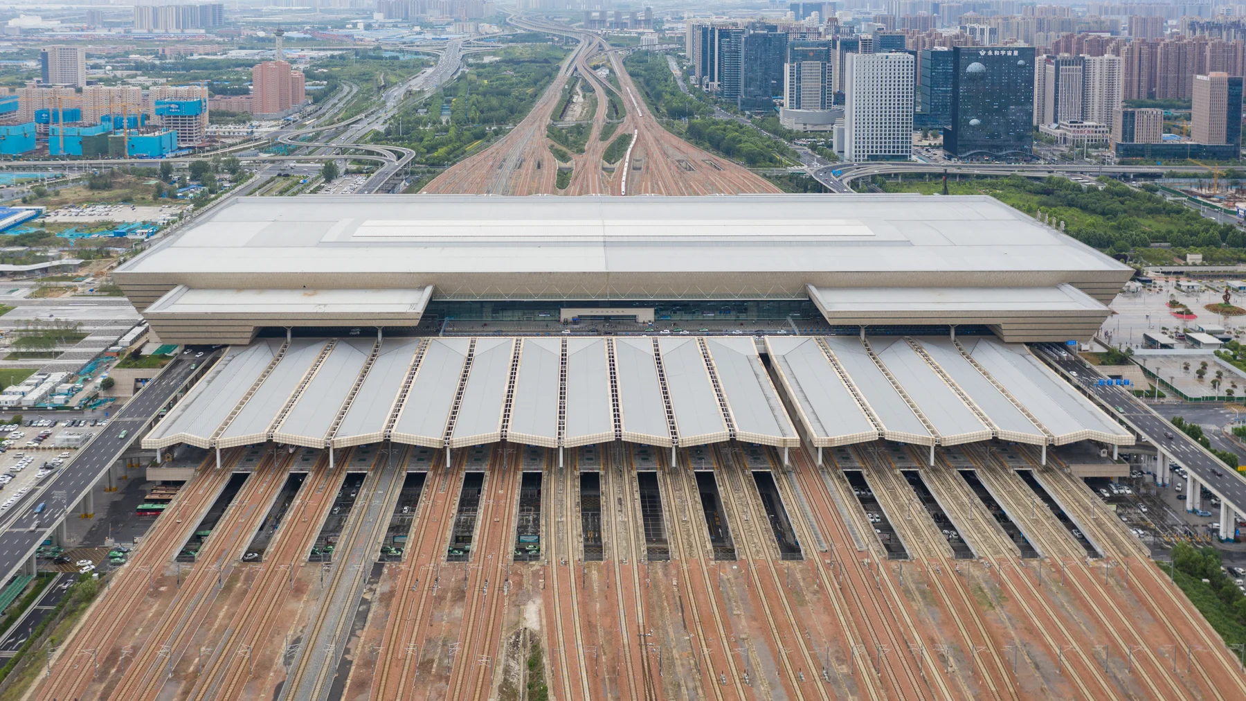 Aerial view of the broad platforms and roof of Zhengzhou East Station