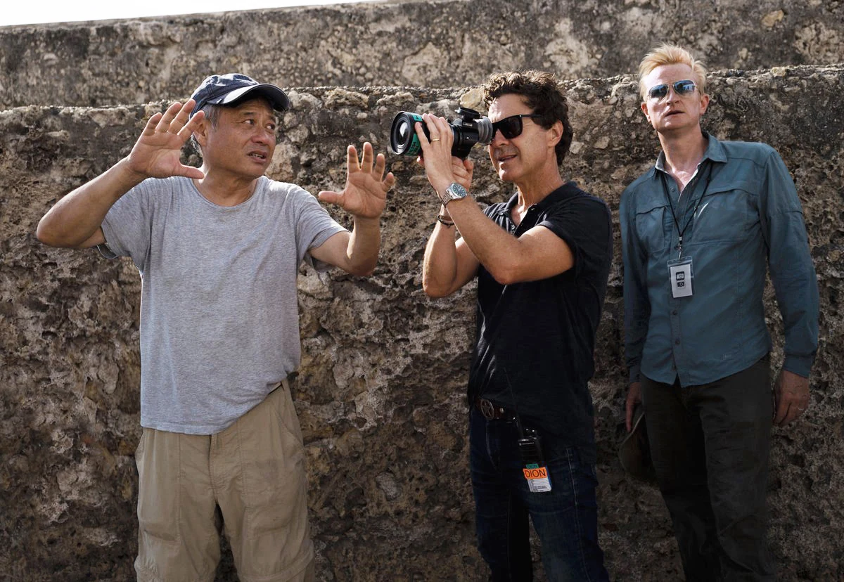 Ang Lee directing beside cinematographer Dion Beebe and production designer Guy Hendrix Dyas on the Gemini Man set