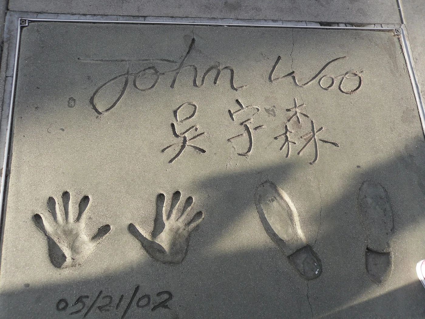 John Woo's signature, handprints and footprints at Grauman's Chinese Theatre