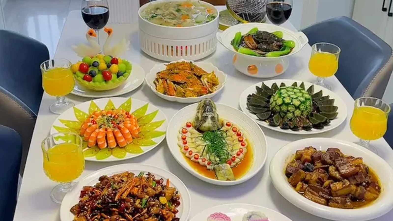 Mid Autumn Festival family reunion table with shared dishes, fruit, drinks and small mooncakes
