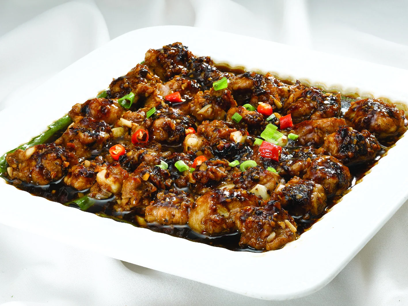 Cantonese steamed ribs with fermented black beans, showing sauce, fat and bite-sized cutting